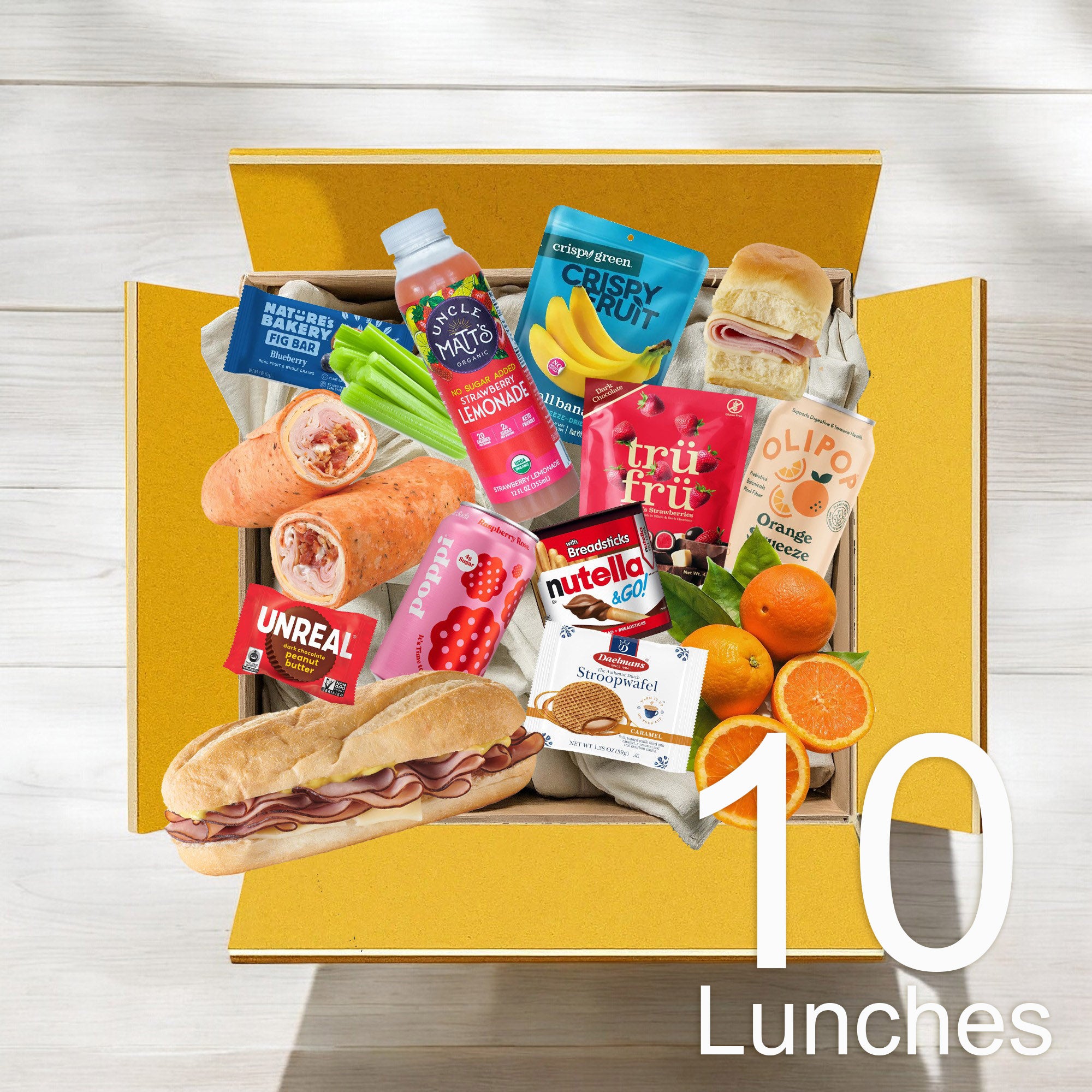 A yellow box containing a variety of snacks and food items, including a sub sandwich, wraps, fruits, beverages, and various packaged snacks. Text on image reads: "Teens 10 Lunch Bundle - Easy Lunches $8.99 per lunch - Save more with every bite."
