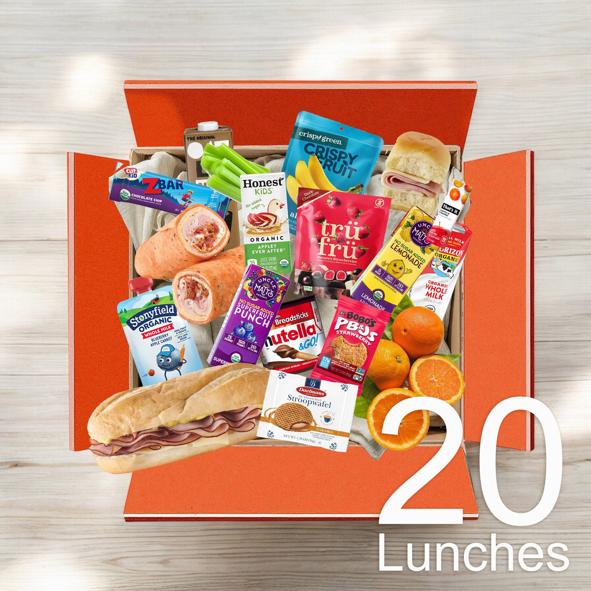 An open orange box labeled "Kids 20 Lunch Bundle" from Easy Lunches contains an assortment of 20 lunch items, including sandwiches, snacks, fruits, and drinks. The number "20" is prominently displayed on the lower right corner. Each lunch bundle is priced at $6.99.