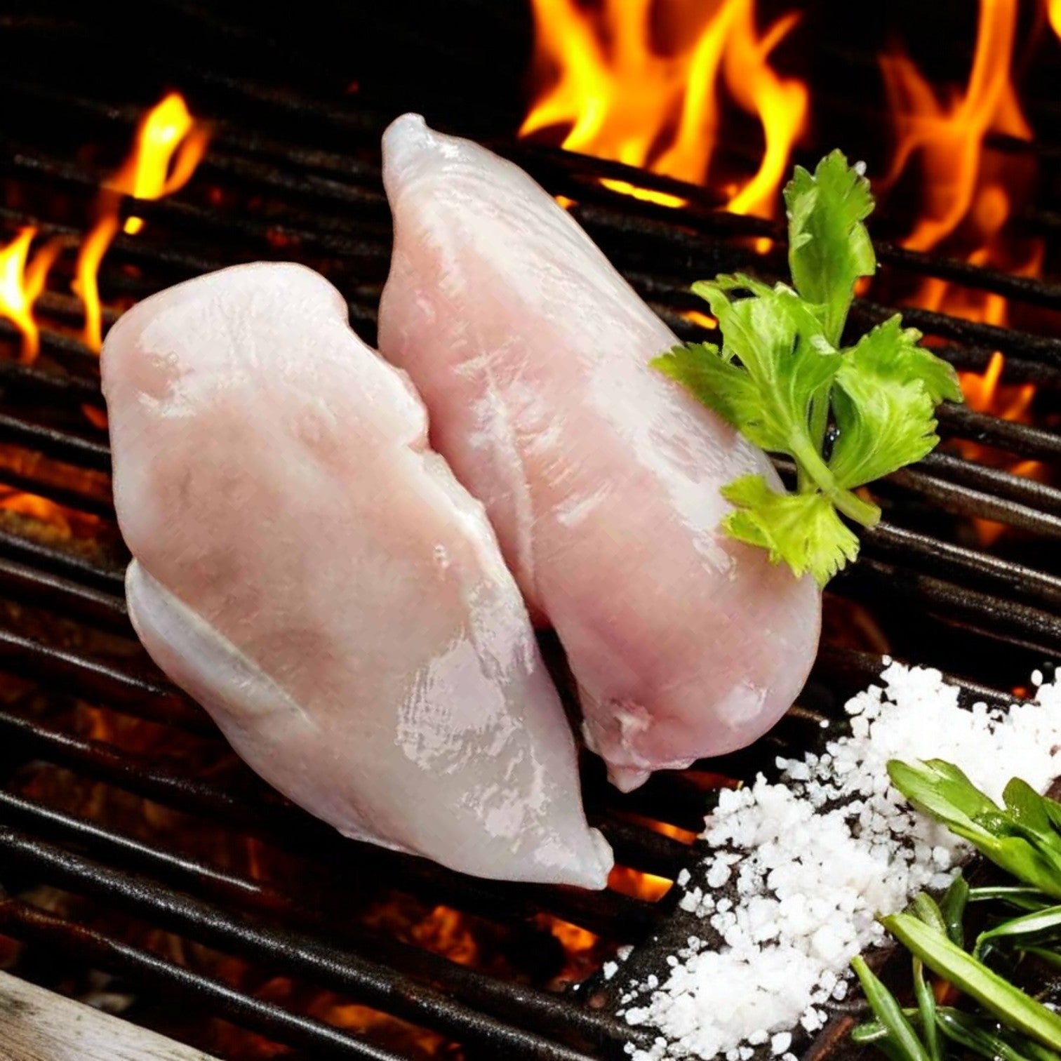 Raw chicken breasts sizzle on the grill as flames dance, enhanced by salt and parsley. Nearby, a Mino Prime Steaks - Top Seller Box wet-aged New York strip steak awaits its turn—a premium cut that promises unrivaled flavor from Mino Prime Steaks.