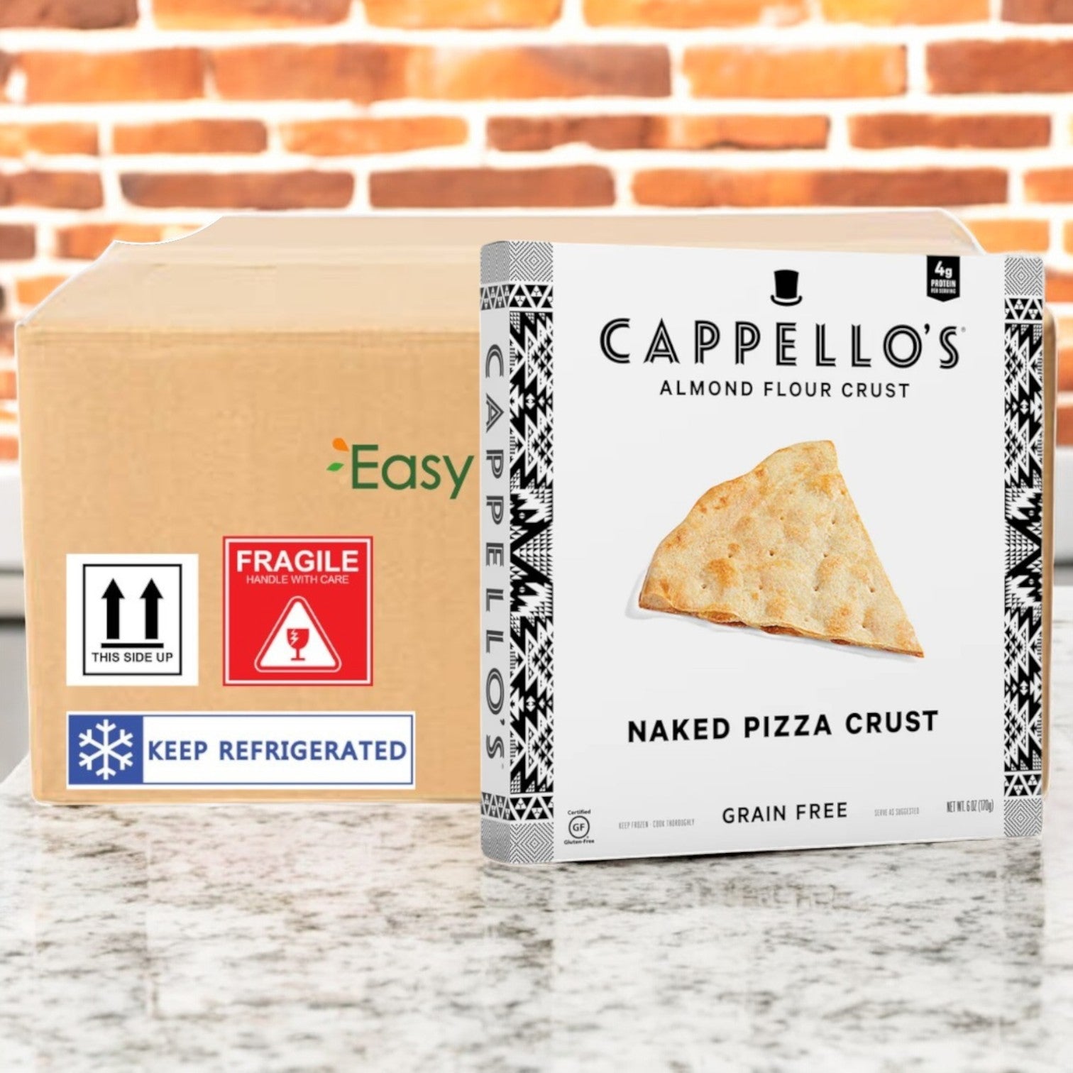 Cappello's Grain Free Naked Pizza Crust, 6 oz. pack, sits on a counter beside a cardboard shipping box marked for refrigeration and fragility.