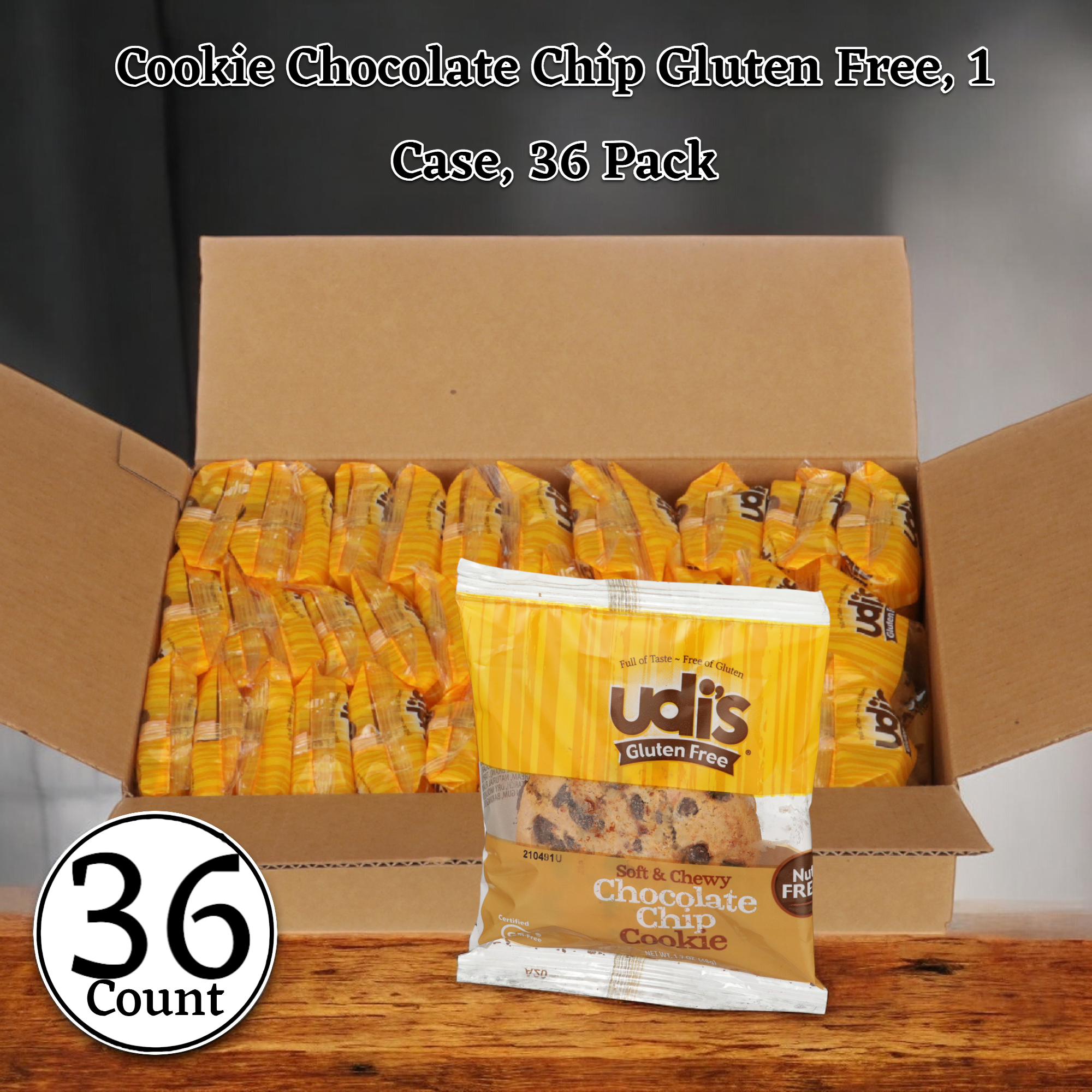 Open case of Udi's Cookie Chocolate Chip Gluten Free with 36 individually packaged packs, each in bright yellow wrapping and labeled "Soft & Chewy.