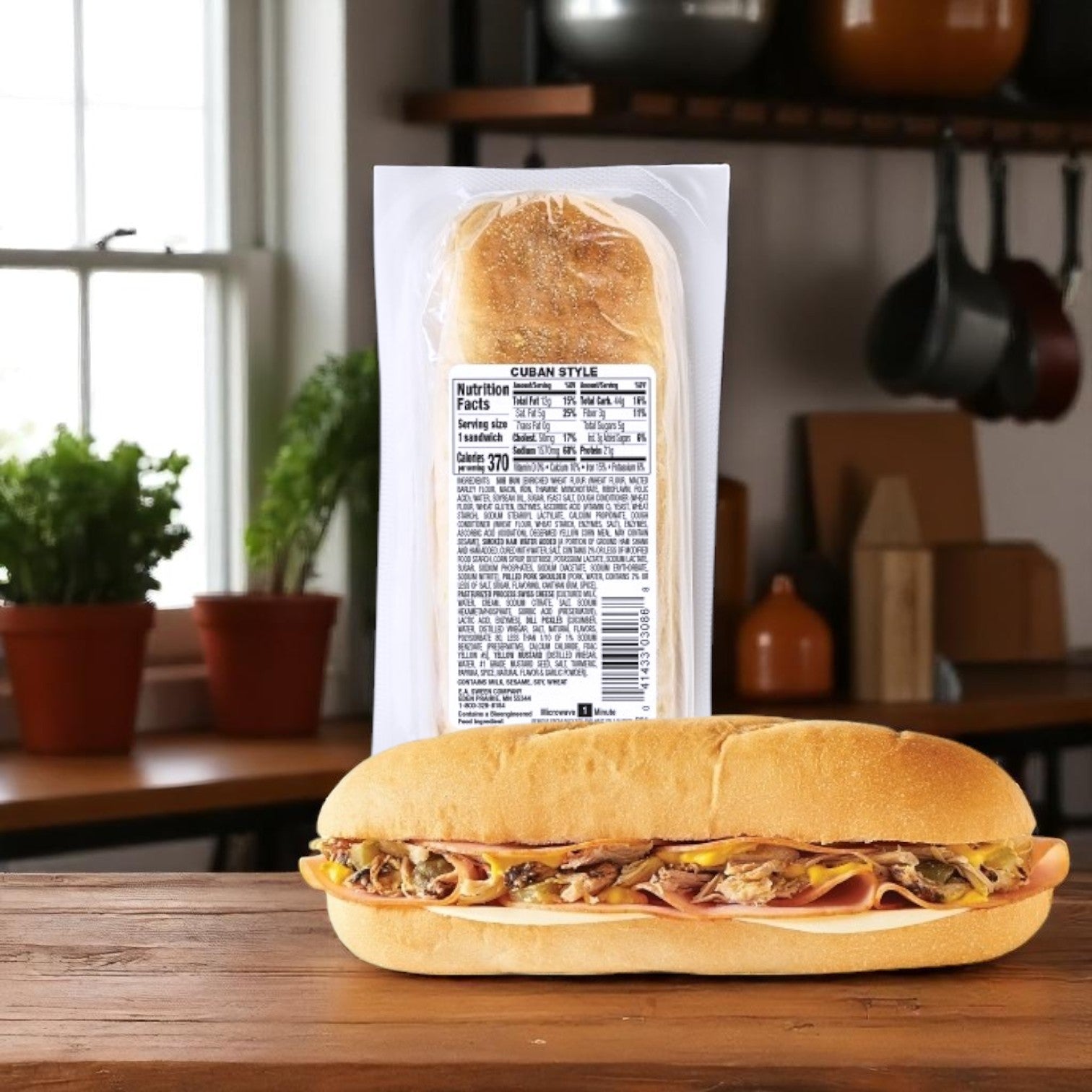 An E.A. Sween Deli Express Cuban Style Sandwich – 6.4 oz (Individually Wrapped) is displayed on a kitchen counter with its label visible, next to an unwrapped sandwich ready to eat.