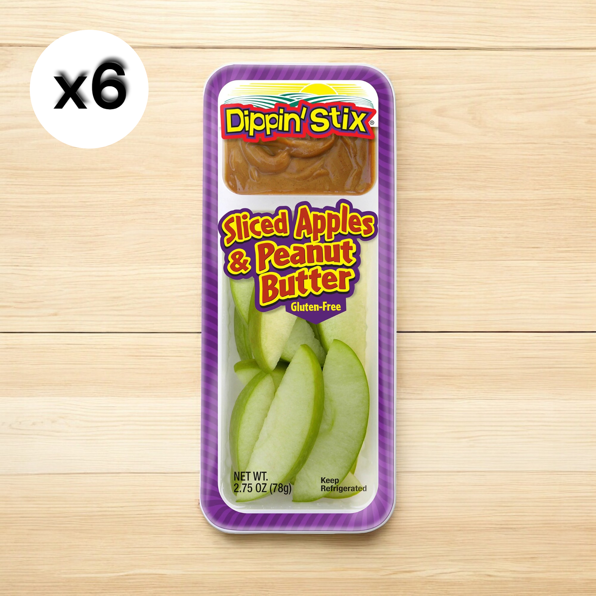 Packaged snack tray featuring sliced green apples and creamy peanut butter. Label reads "Easy Lunches Dippin' Stix - 6 Pack of Sliced Apples & Peanut Butter, Gluten-Free." Quantity indicator shows "x6.