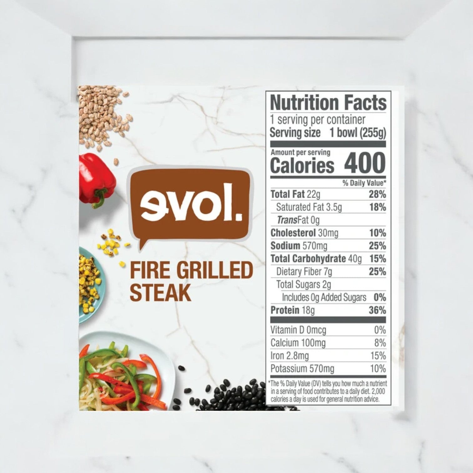 A package of Evol Gluten Free Fire Grilled Steak, 9 oz. - 1 Count with a visible nutrition facts label, including details like 400 calories, 22g total fat, and 570mg sodium per serving—perfect for those who savor a gourmet experience.