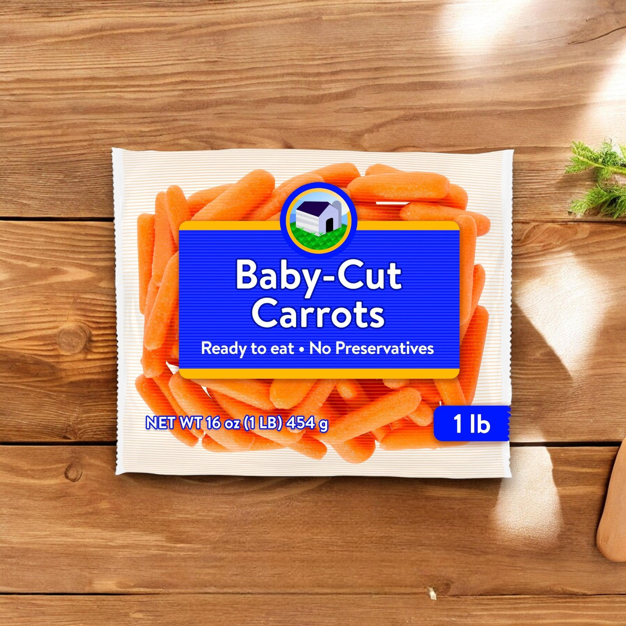 A package of Easy Lunches 1lb Baby Peeled Carrots on a wooden surface. The front label reads, "Baby Peeled Carrots, Ready to eat, No Preservatives, 1 lb (16 oz, 454 g)." Packed with vitamin A for a healthy boost and perfect as a low-calorie snack.