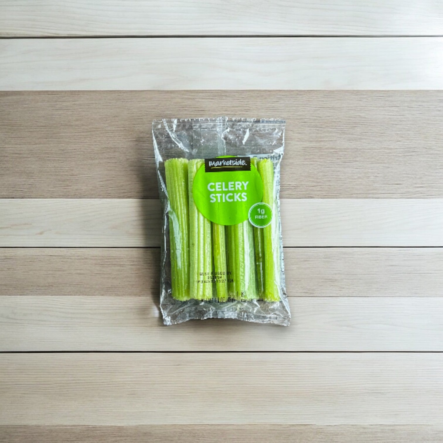 Easy Lunches' Celery Fresh Sliced 1.6 oz Pack - 1 Count, adorned with a green label featuring "1g Net Carbs," is now available in convenient 1.6oz packs and presented on a wooden surface.