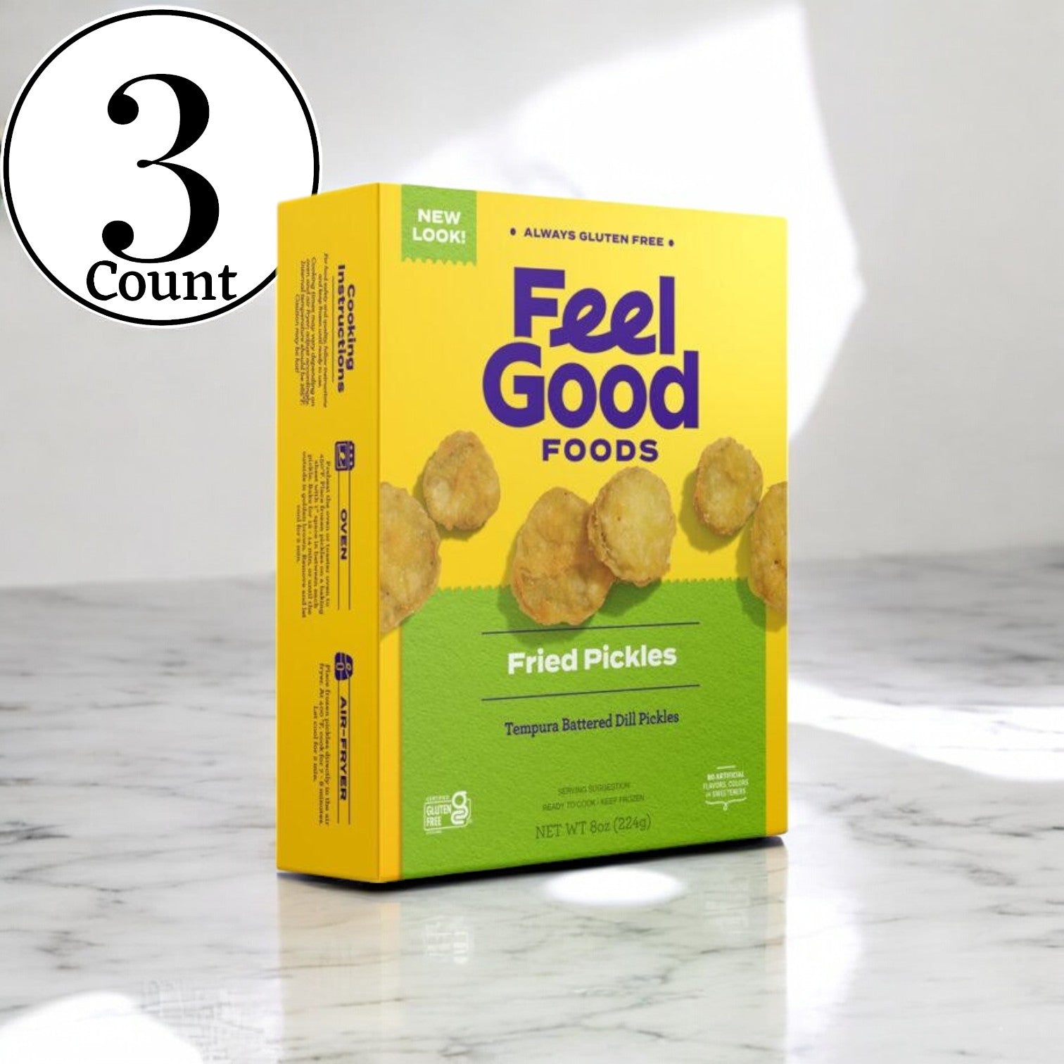 Three boxes of Feel Good Foods Fried Pickles, 8 oz. each, are displayed on a marble surface, showcasing tempura-battered dill pickles for the ideal crunchy snack.