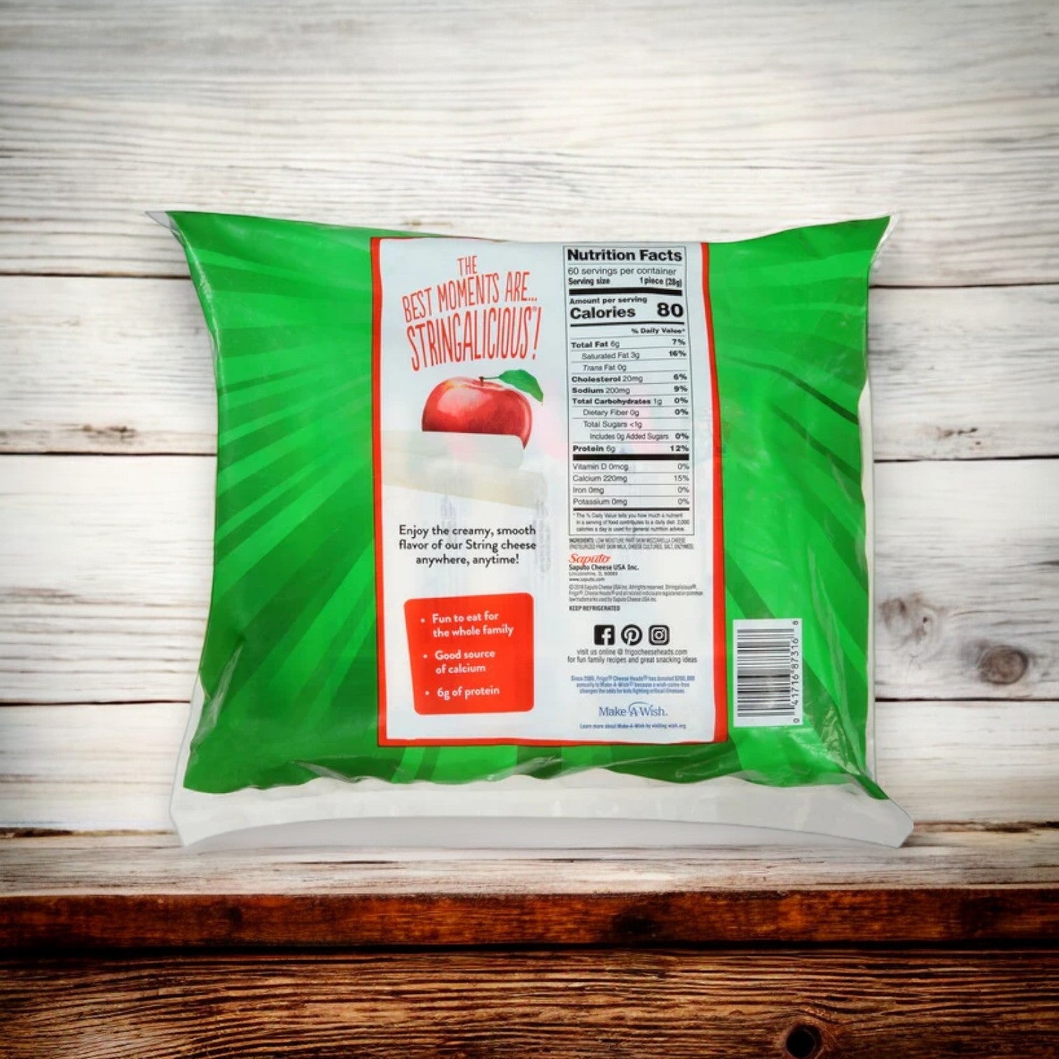 The back of the mostly green package features nutritional info, contact details, an image of Mozzarella String Cheese, and the slogan "The best moments are stringalicious!" Perfect as a low-calorie snack, Frigo® Cheese Heads® Original Mozzarella String Cheese Snacks come in 1 oz. packs with 5 bags per set (300 Count).