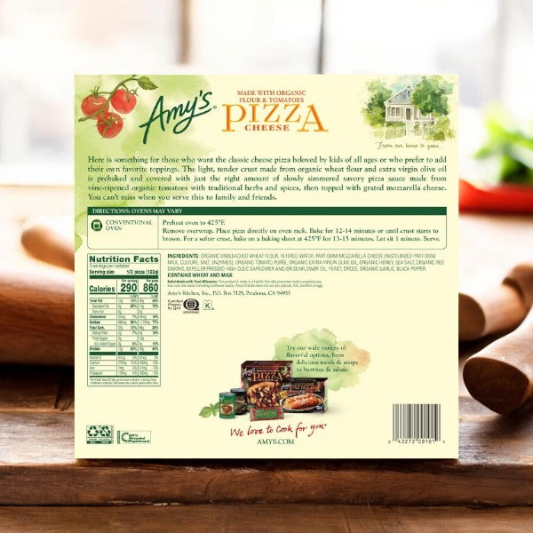 A box of Amy's Cheese Frozen Pizza-1 Count by Amy's sits on a wooden surface, showcasing product information, cooking instructions, nutritional facts, and an image of the organic cheese pizza.