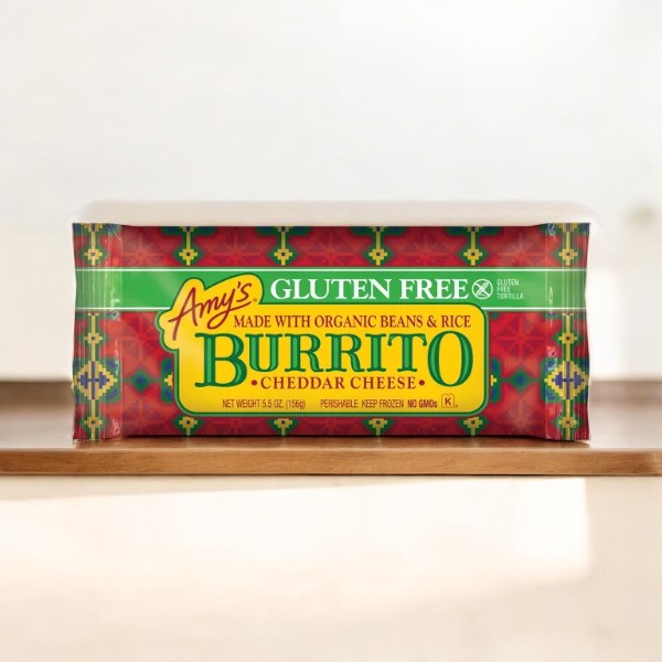 Amy's Gluten Free Bean & Cheese Frozen Burrito-1 Count, made by Amy's with organic beans and rice, is displayed on a wooden surface. This microwave meal combines convenience with the wholesome goodness of organic ingredients.