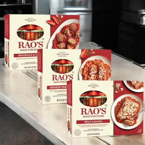 Boxes of Easy Lunches' Rao's Lunch Bundle, featuring 1 Chicken Parmesan (25 oz), 1 Meatballs and Sauce (24 oz), and 1 Meat Lasagna (25 oz) - a total of three boxes - are placed on a kitchen counter.