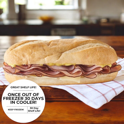 A Smoked Ham & Swiss Cheese Sub, produced by E.A. Sween, sits on the kitchen countertop. A label states, "Great shelf life! Once out of freezer, 30 days in cooler!