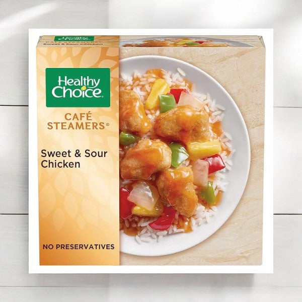 Packaging of the Healthy Choice Meals Bundle, showcasing a variety of options including Sweet & Sour Chicken with chicken, vegetables, and rice on the front. The box emphasizes "no preservatives," making it a great choice for those in search of nutritious meals. Perfect for quick lunches or dinners, each bundle includes 8 total meals: 2 Beef Teriyaki, 2 Sweet and Sour Chicken, 2 Beef Merlot, and 2 Grilled Chicken Marinara with Parmesan.