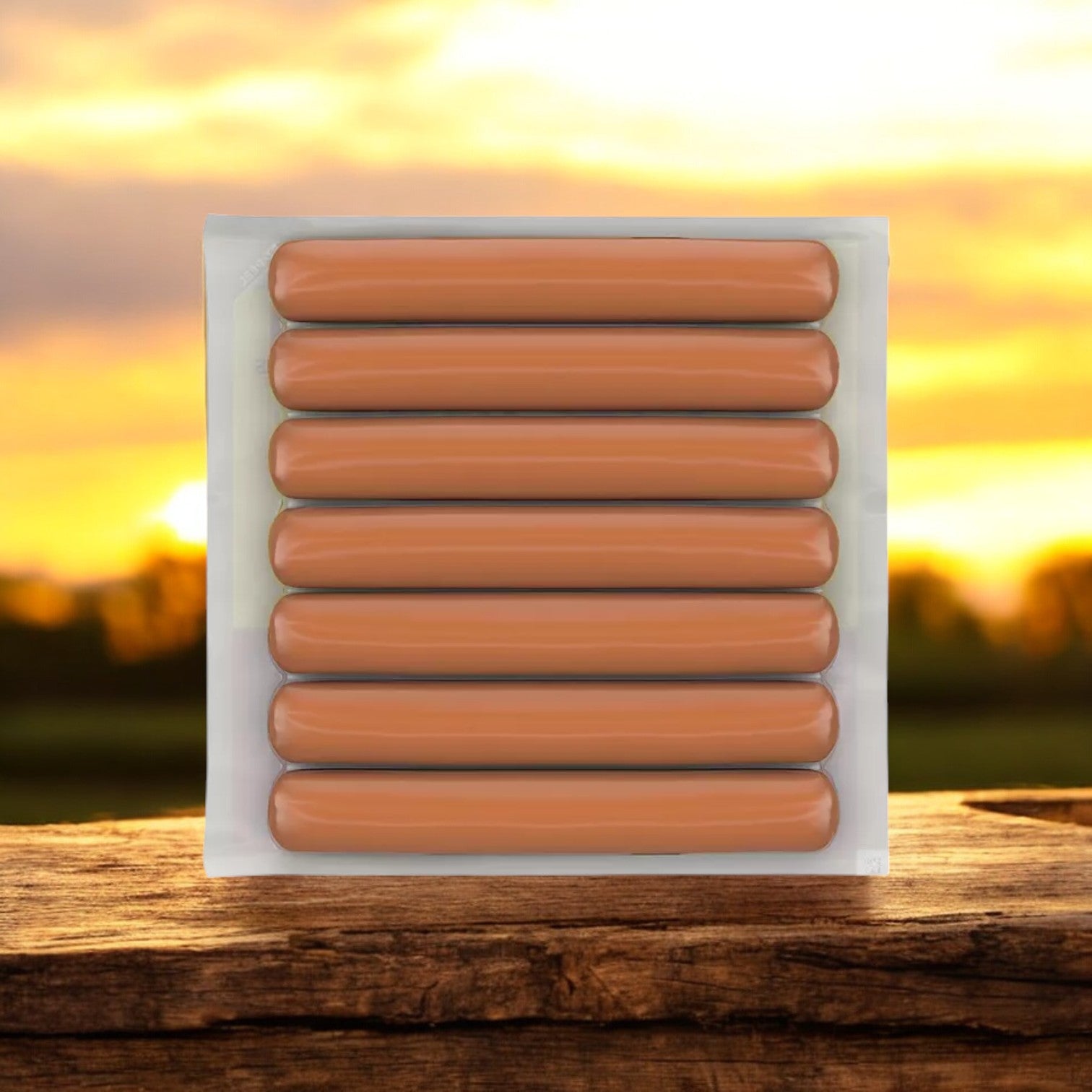 Three packs of Easy Lunches Hebrew National Beef Franks, 10.3 oz each, sit on a wooden surface outdoors, highlighted by a golden sunset in the background.