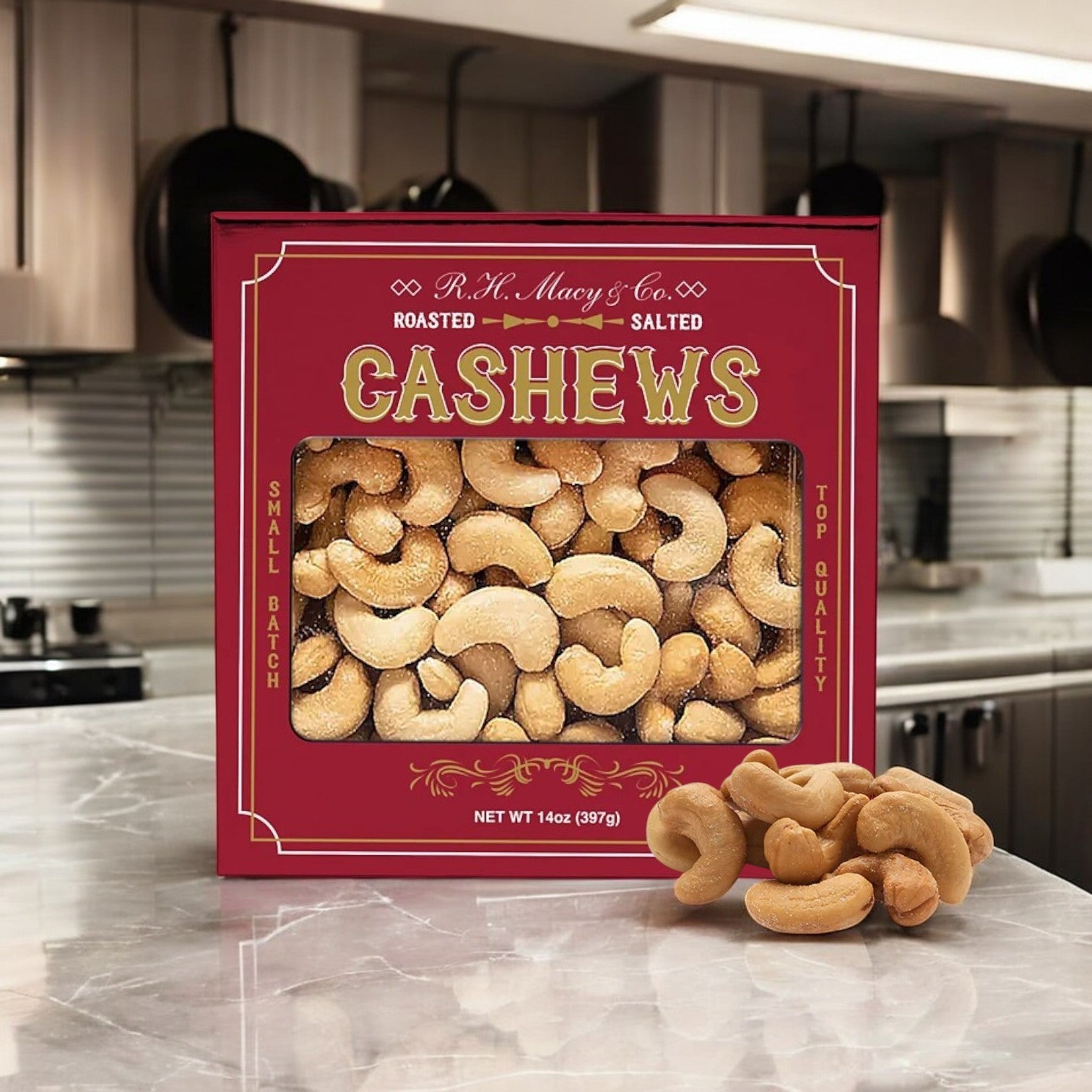 A 14 oz Roasted Salted Jumbo Cashews Gift Box from Macy's sits on the counter, showcasing premium quality with a small pile in front—perfect as a holiday gift.