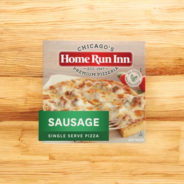 A box of Home Run Inn Mini Personal Pizza, Classic Frozen Sausage Pizza, 8.5 oz., from the 1 Case with 5 Packs variety sits invitingly on a wooden surface.