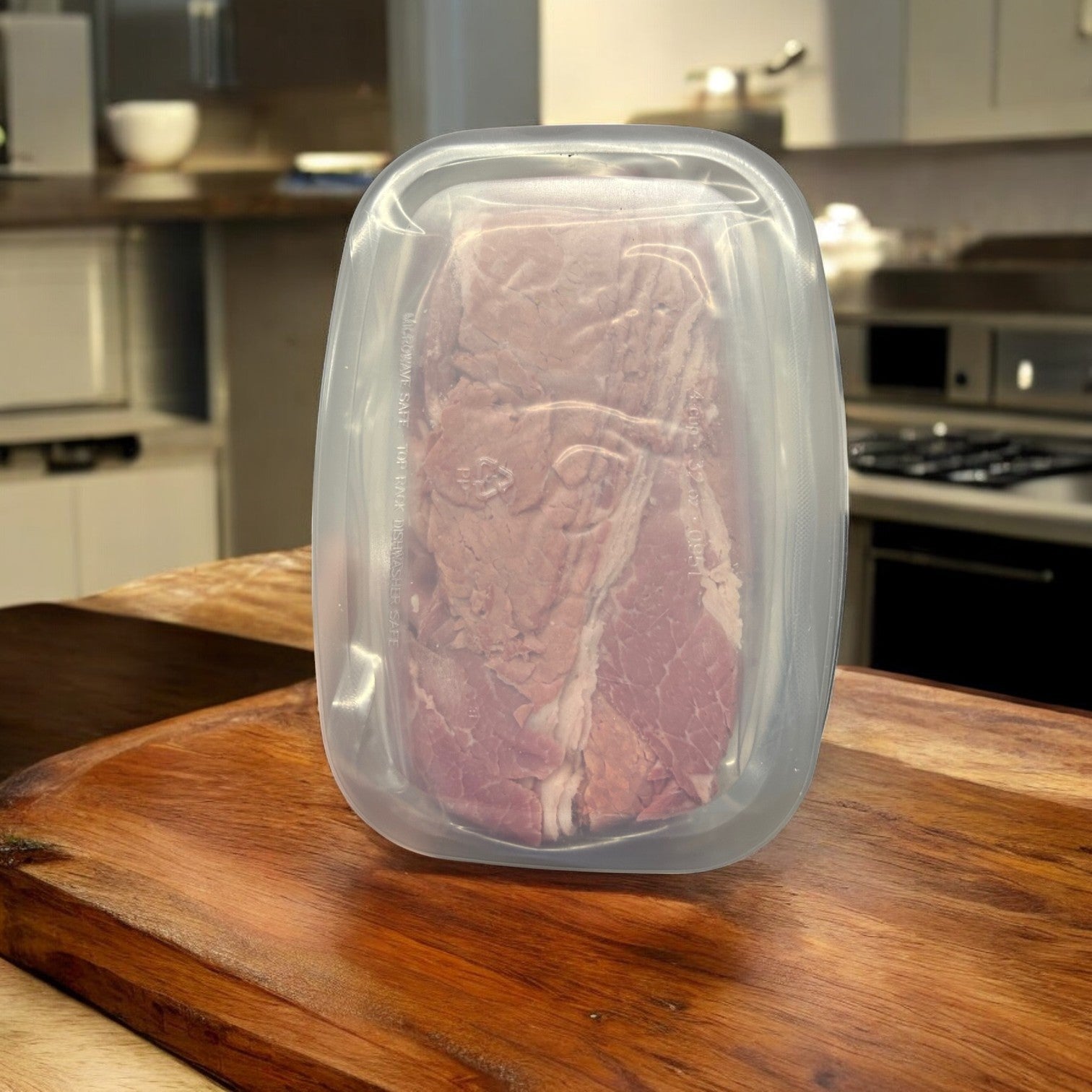 A vacuum-sealed package of Manny's Cooked Corned Beef Brisket-3 Count stands upright on a wooden countertop in a modern kitchen, with hints of traditional spices subtly wafting through the air.