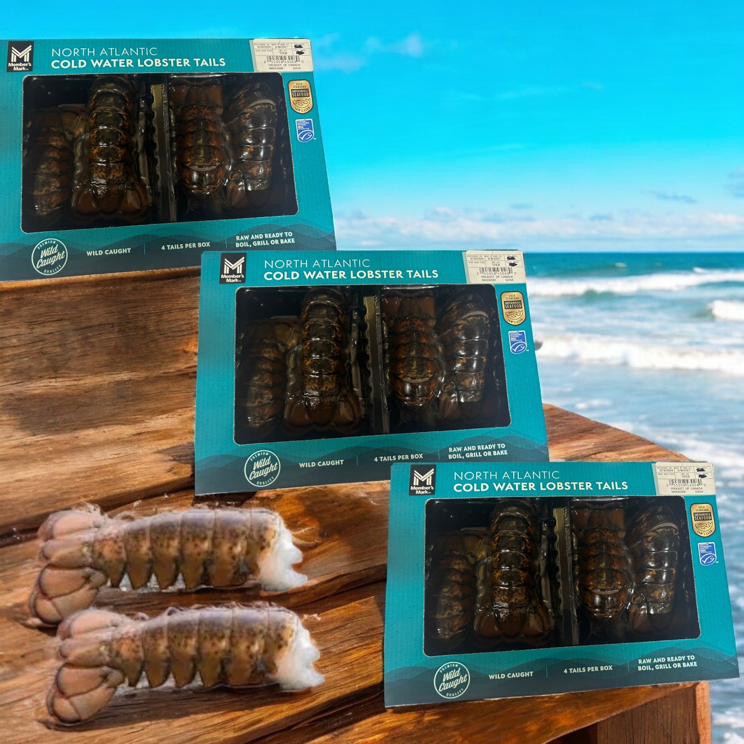 Three packs of Easy Lunches Member's Mark Cold Water Lobster Tails, Frozen, 4 Count each, are arranged on a wooden surface near the ocean with two loose lobster tails in front.