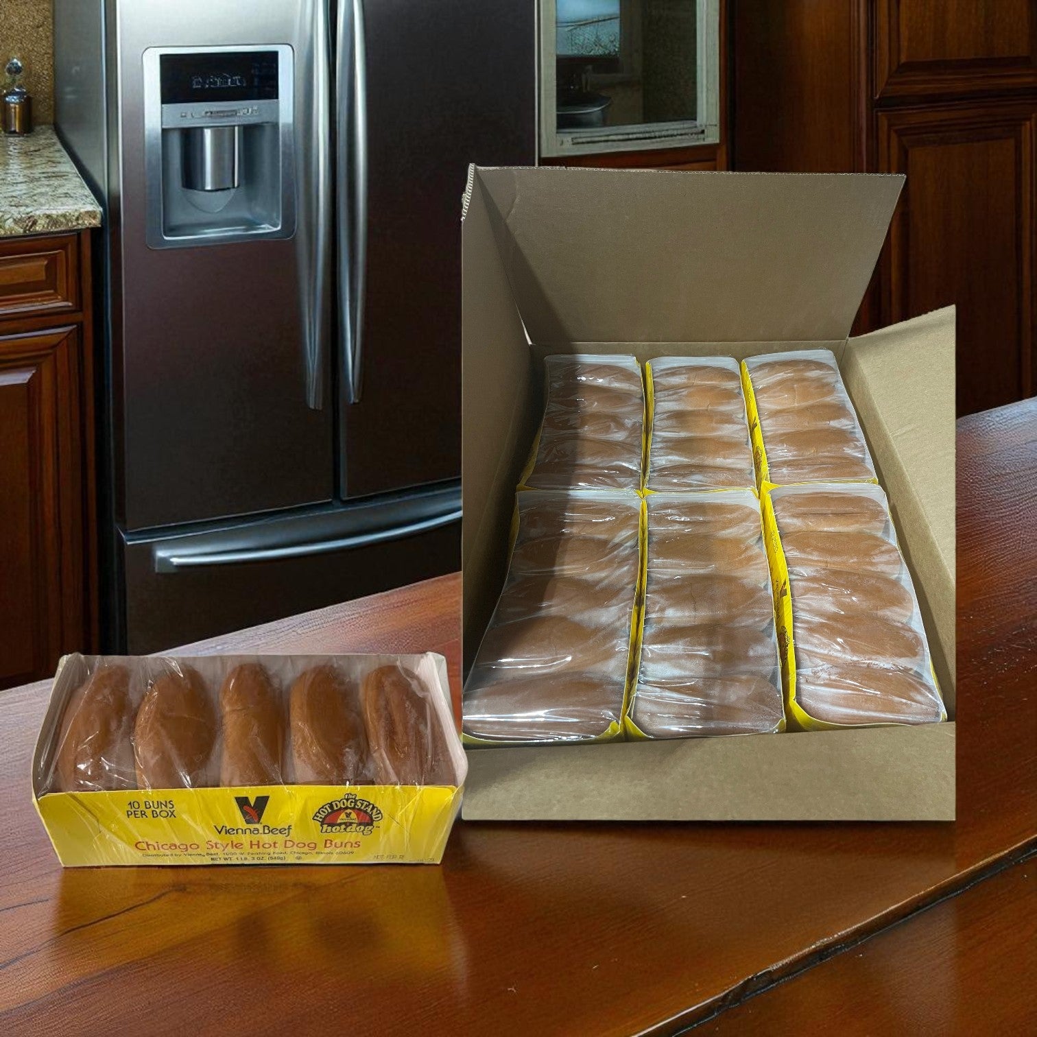 A case of Vienna Beef Plain Hot Dog Buns—12 packs of 10 buns each, 120 total—rests on a wooden counter, with multiple packages inside and one opened pack of Chicago-style hot dog buns next to it.