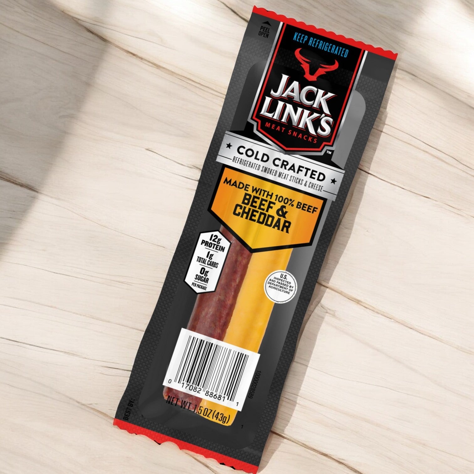 Introducing Jack Link's Cold Crafted Beef Stick & Mild Cheddar Cheese Combo, a delicious 1.5 oz snack pack providing 12g of protein per serving. Made with 100% beef and cheddar, this high-protein snack features the rich taste of hardwood smoked goodness, perfect for those seeking a flavorful and satisfying bite.