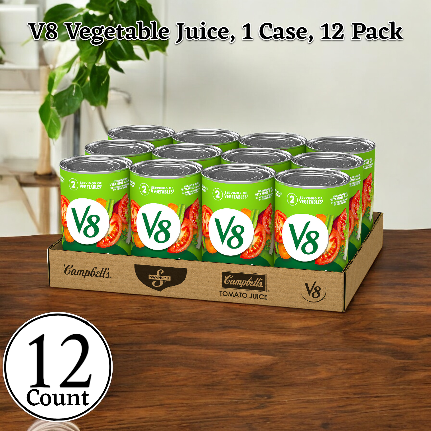 A 12-pack case of V8 Vegetable Juice, each can containing 46 oz. of juice and adorned with the V8 logo alongside images of tomatoes and vegetables, is displayed on a wooden surface. This antioxidant-rich beverage serves up essential vitamins for a healthy boost.