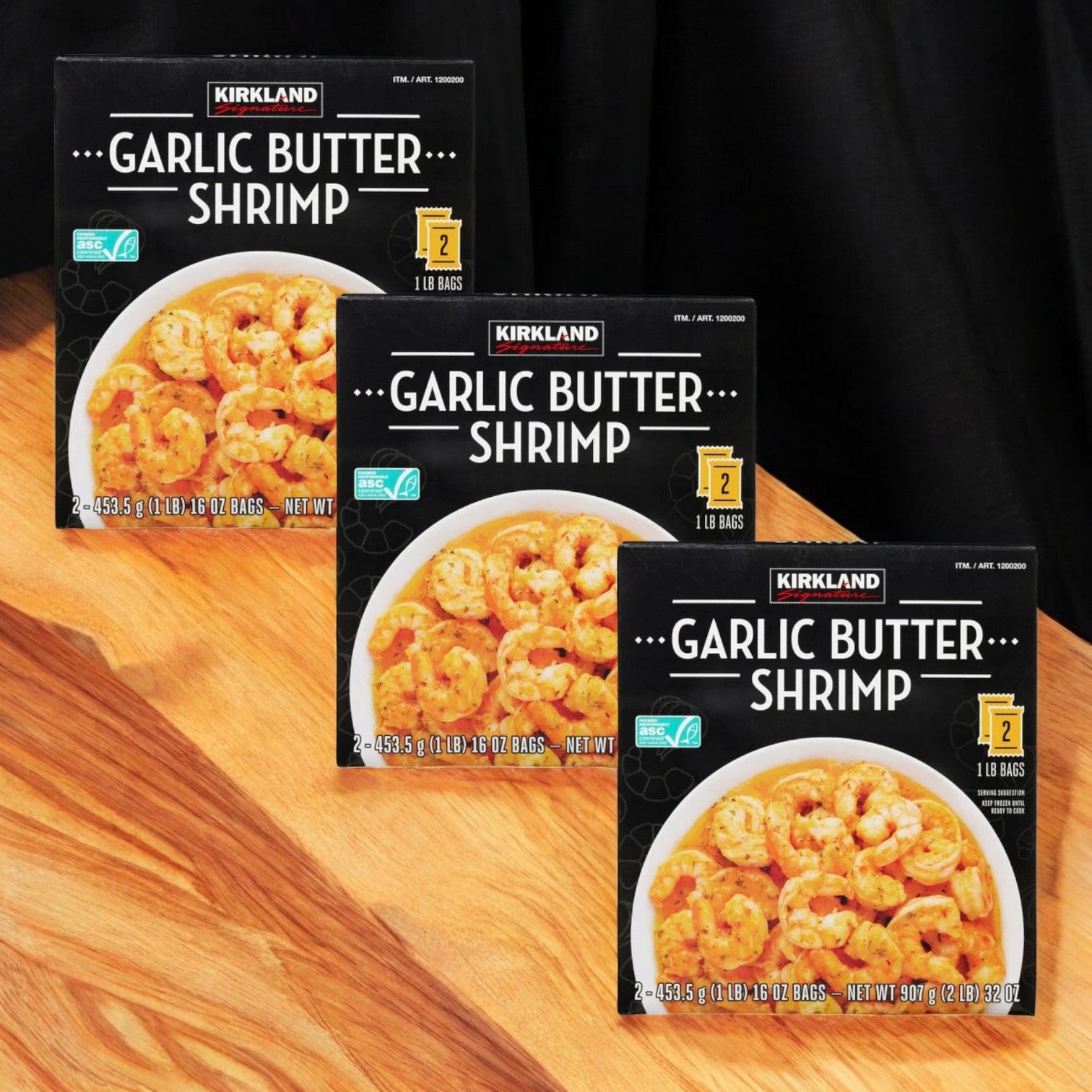 Seafood enthusiasts will enjoy the Costco Kirkland Garlic Butter Shrimp set, featuring three boxes from Kirkland Signature. Each box includes two 1-pound bags for effortless preparation on a wooden surface.