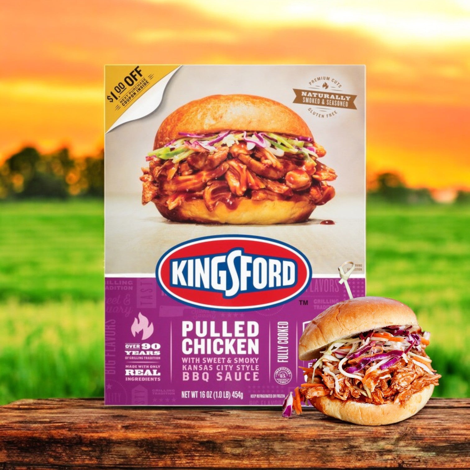 A display of Kingsford Pulled Chicken – 16 oz shines outdoors with a sweet and smoky Kansas City Style BBQ flavor, set against a blurred grass and sky background.