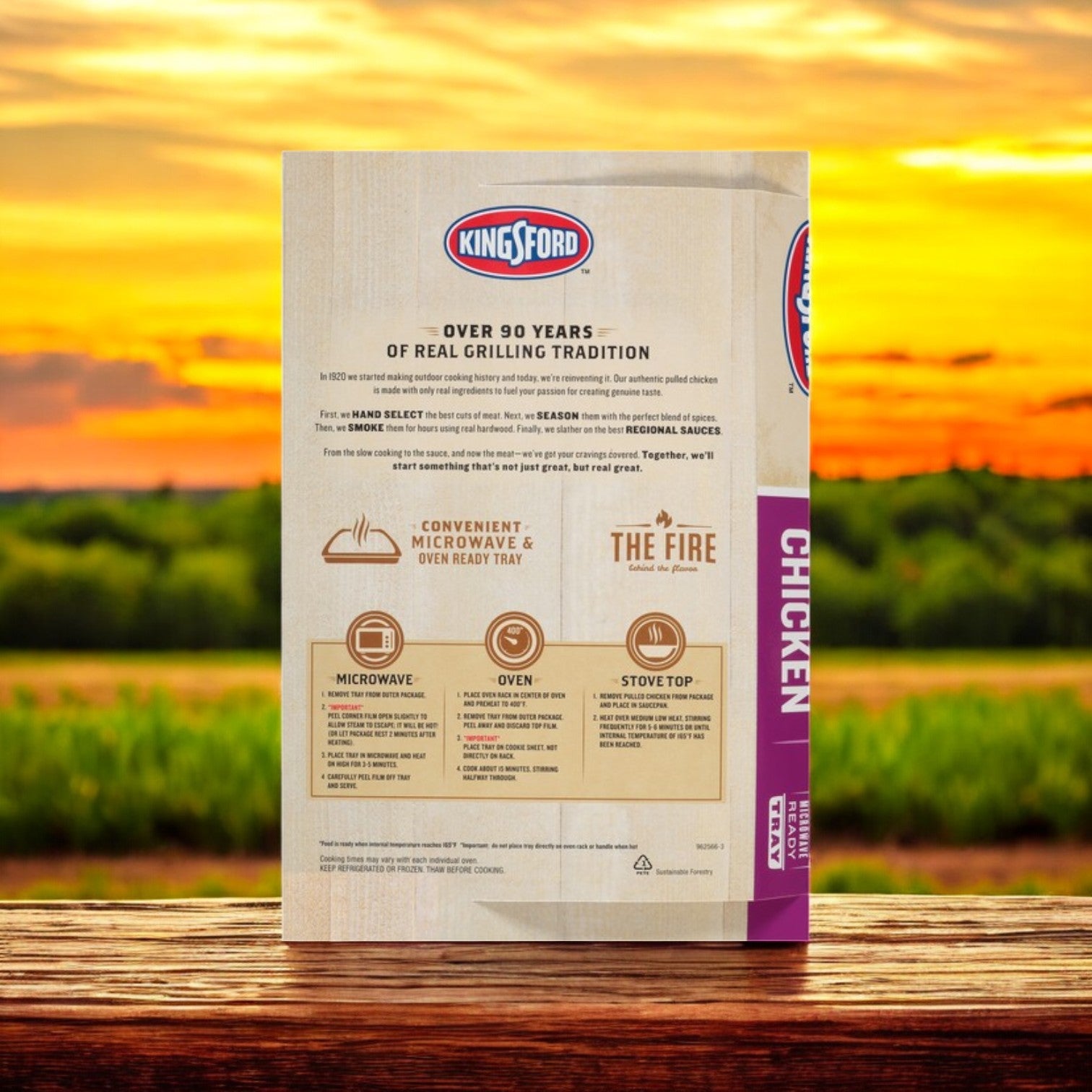 On a wooden table outdoors, the back of a Kingsford Pulled Chicken 16 oz package displays BBQ Flavor cooking instructions for microwave, oven, and stovetop methods as a sunset adds warmth to the background, setting the scene for an ideal feast.