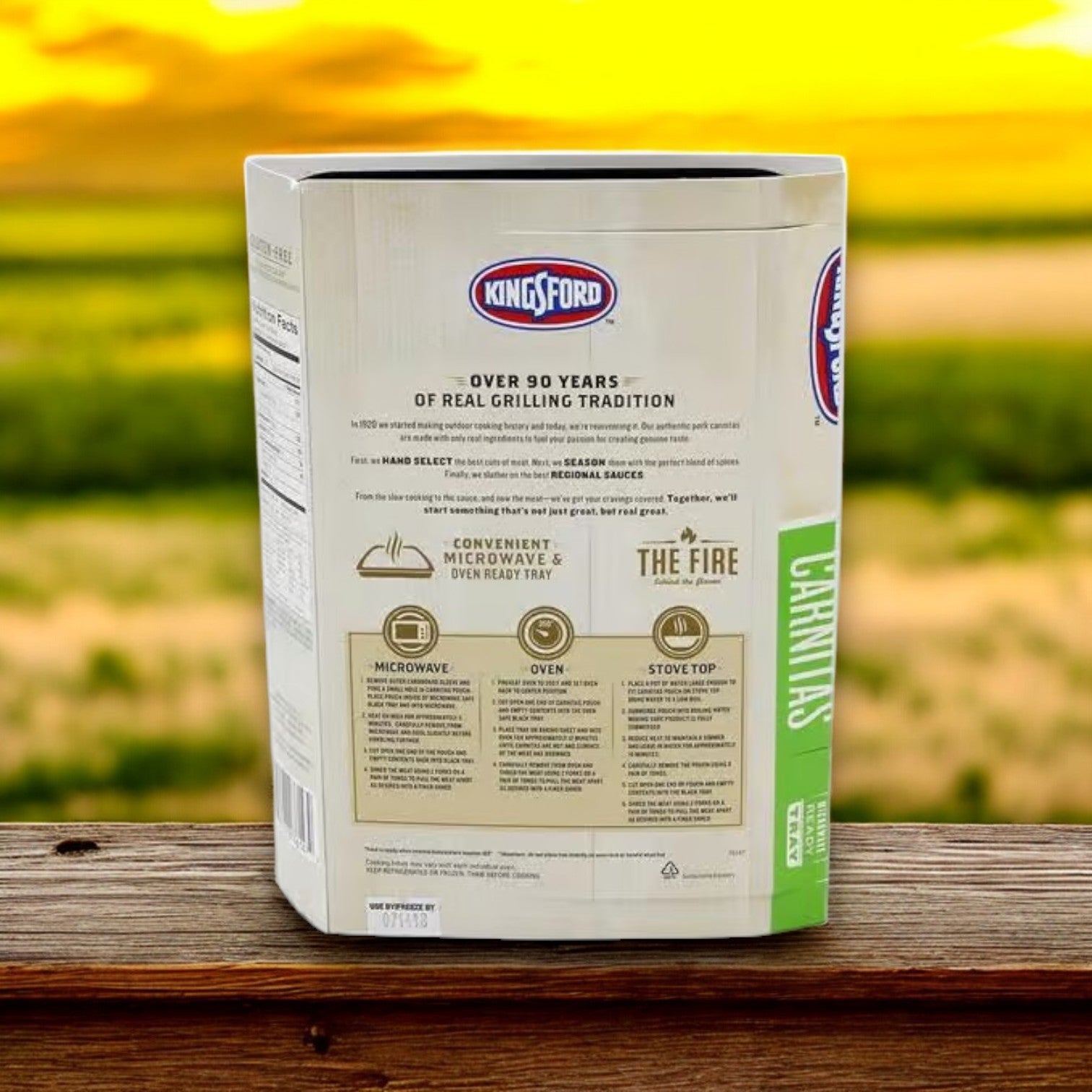 A square container of Kingsford Seasoned Pork Carnitas sits on a wooden surface with a blurred outdoor background. The label highlights grilling tips, slow-cooked secrets, and seasoning instructions—ideal for mastering pork carnitas dishes.