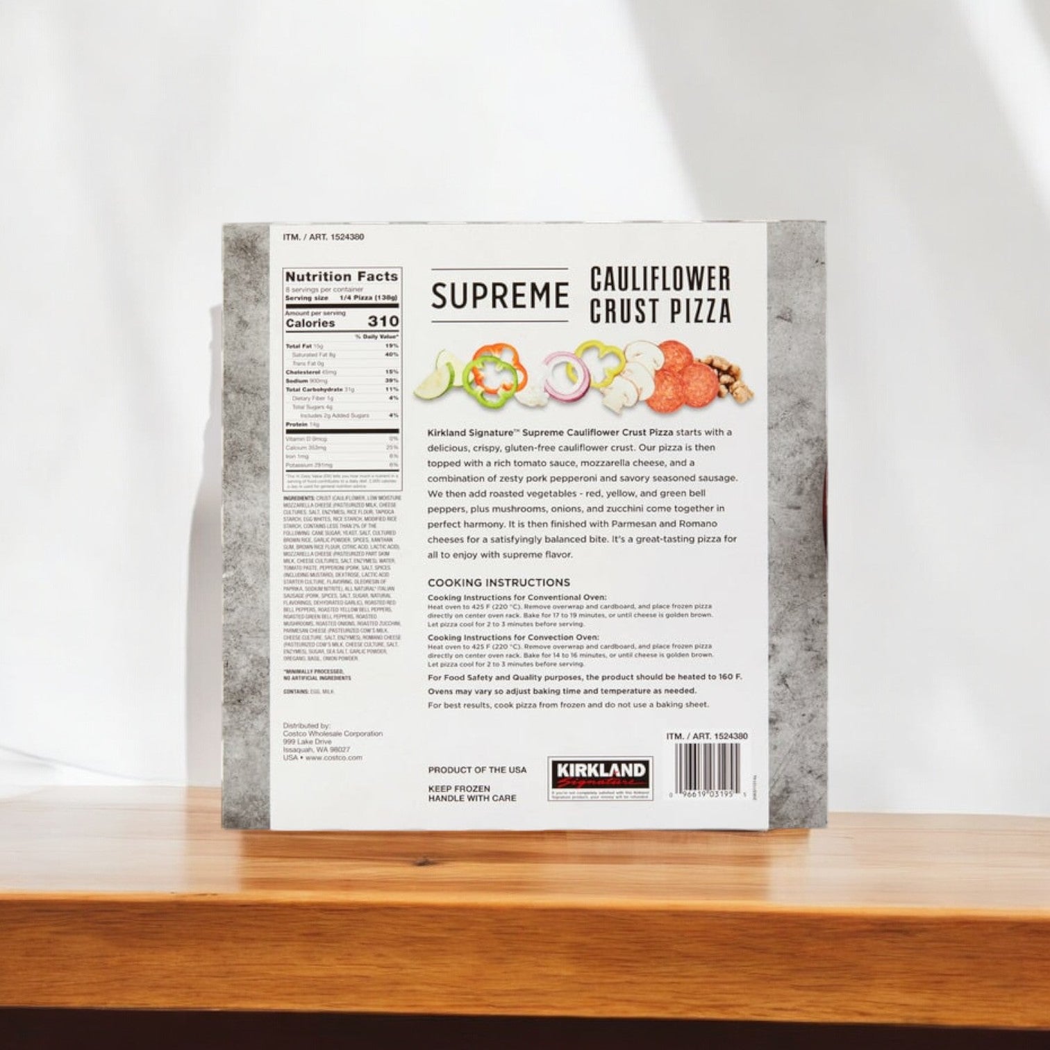 Box of Kirkland Signature Cauliflower Crust Pizza, Supreme, 2-count -3 Pack on a wooden surface, displaying nutritional facts and cooking instructions on the back. This gluten-free pizza from Kirkland Signature is generously loaded with supreme toppings for a delightful meal.