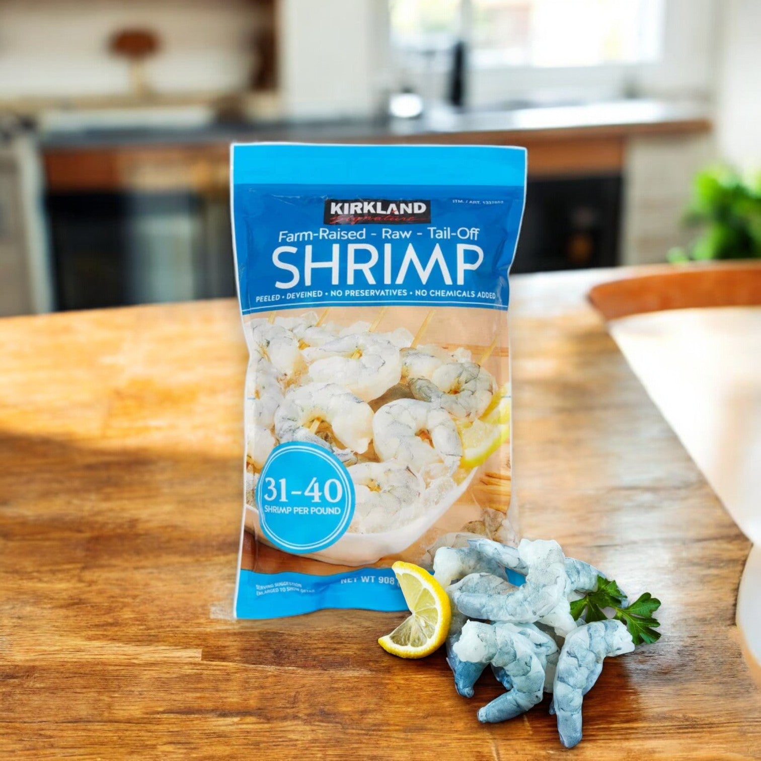 A bag of Kirkland Signature Farm-Raised Raw Shrimp, peeled and deveined, lies on a wooden table with several shrimp from the 31-40-count selection arranged beside a lemon slice.