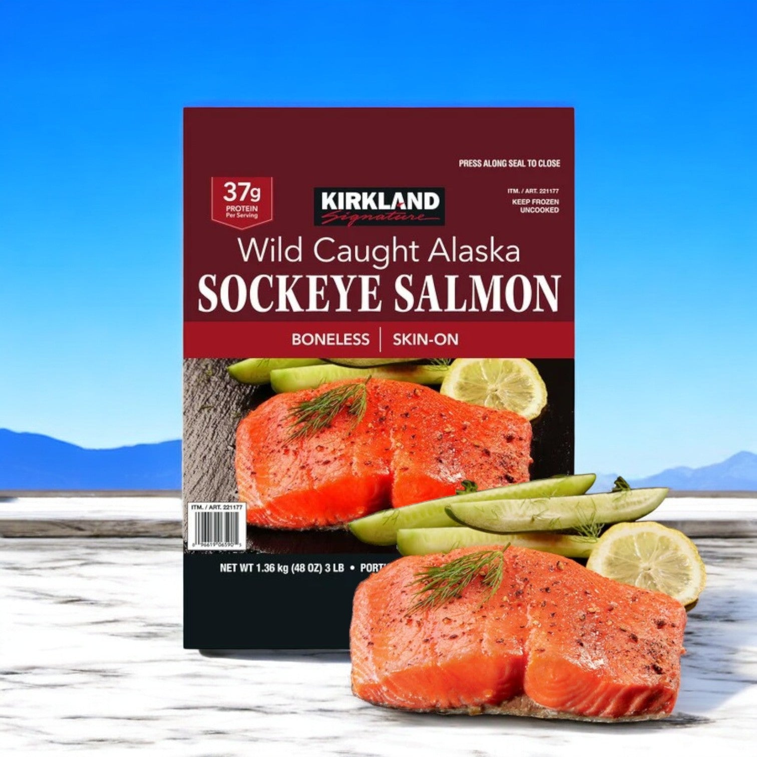 A box of Kirkland Signature Wild Alaskan Sockeye Salmon, sized between 5 oz and 7 oz portions, comes in a 3-pack totaling 9 pounds, is elegantly presented with slices of salmon, lemon, and sprigs of dill on a wooden surface, highlighting its rich Omega-3 fatty acids.