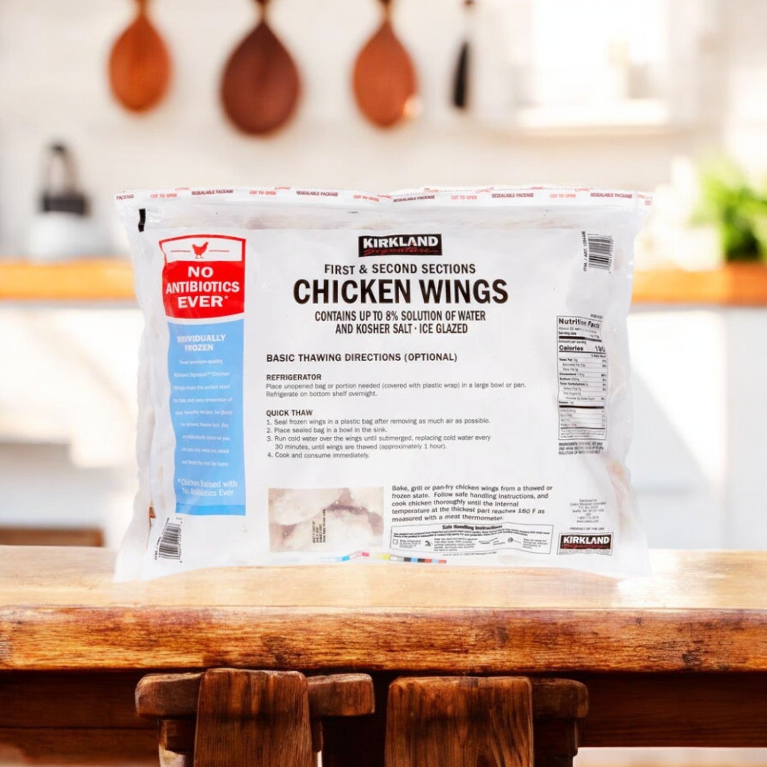 A 30-pound box (3 bags, 10 lbs. each) of Easy Lunches Chicken Wings sits on a kitchen counter, the label visible—ideal for stocking up on bulk wings for your next gathering.