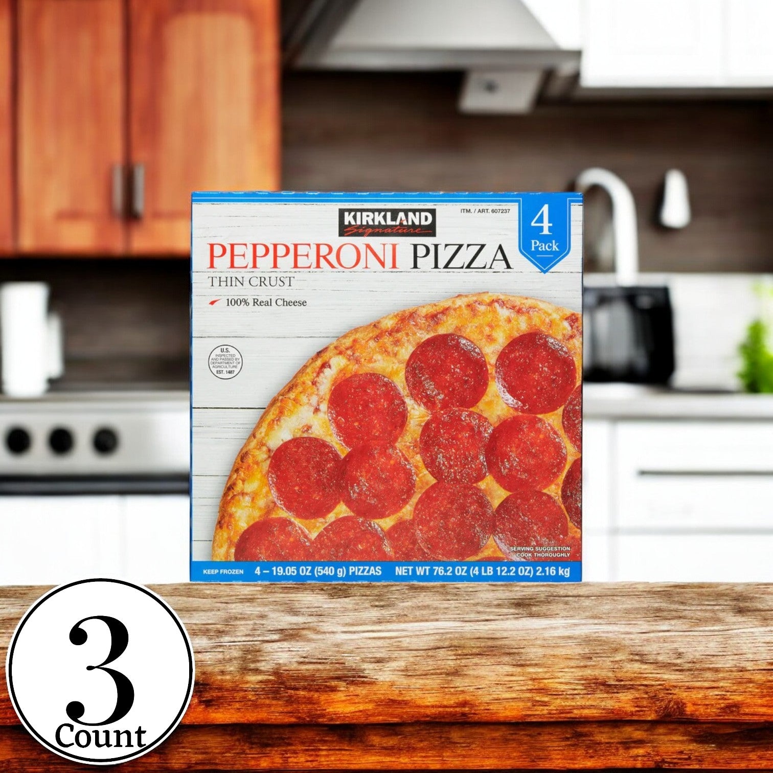 A box of Kirkland Signature Pepperoni Pizza rests on a wooden kitchen counter, featuring a 19.05 oz, 4-count pack made with 100% real mozzarella cheese and a crispy thin crust.