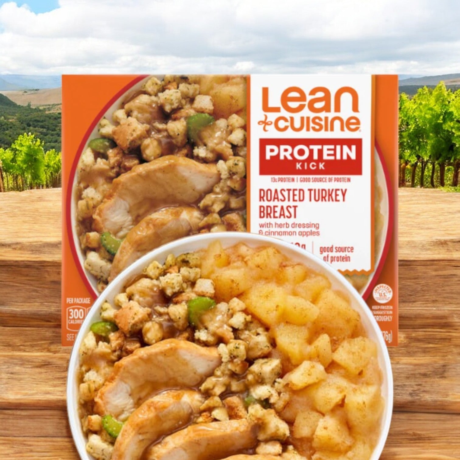 The Lean Cuisine Roasted Turkey Breast, 9.75 oz. - 1 Count, offers a delightful meal complete with turkey, stuffing, and apple slices. Encased in orange packaging that highlights nutritional information alongside a scenic landscape background, it is ideal for anyone needing a quick and convenient low-calorie option, much like the Lean Cuisine Pepperoni Pizza.