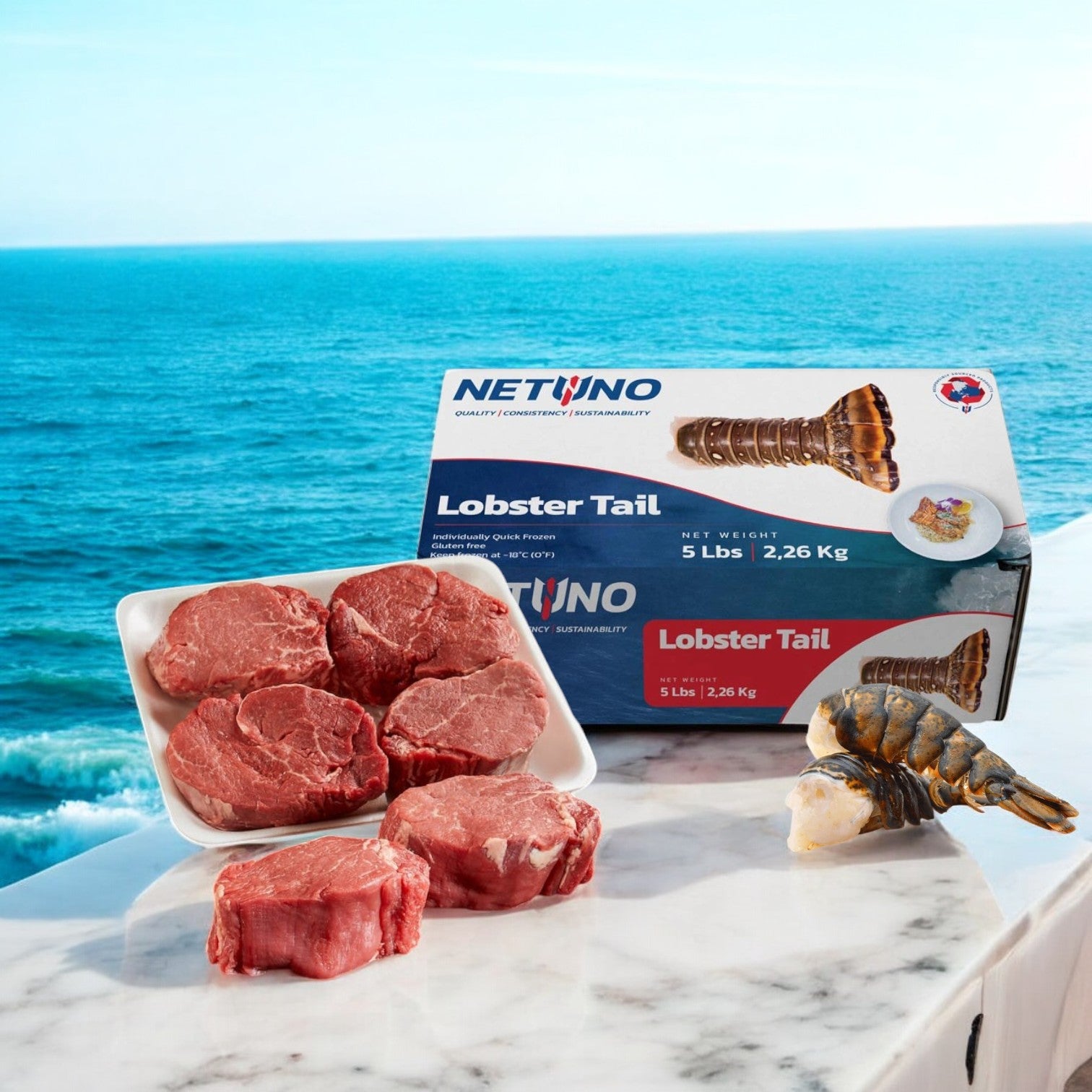 An Easy Lunches box of Surf and Turf, featuring USDA Choice Beef Loin Tenderloin Steak - Filet Mignon and 5 pounds of frozen Netuno Lobster Tails, sits on the table, offering a perfect gourmet experience with an ocean view in the background—with free shipping!