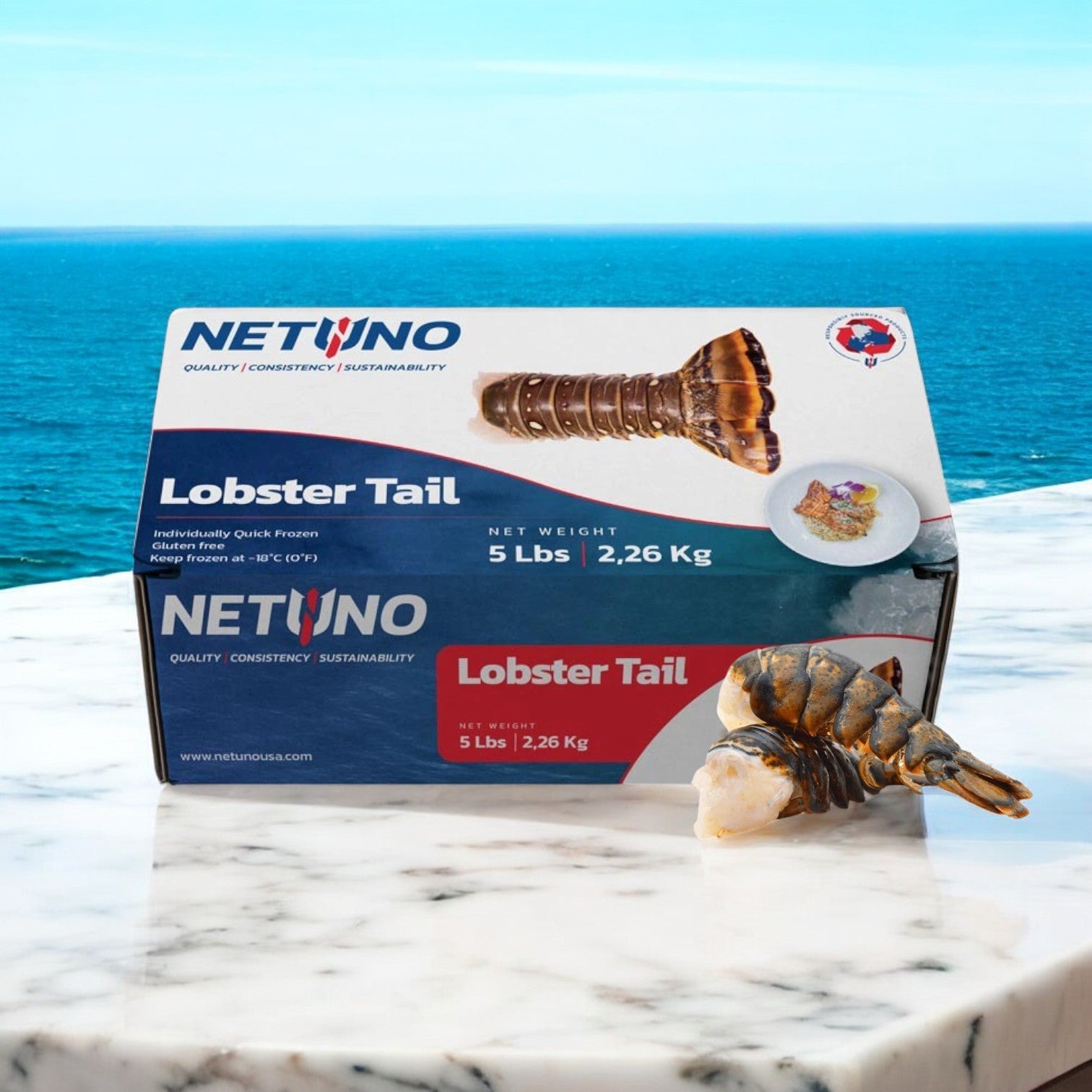 A box of Easy Lunches Surf and Turf! featuring Kirkland Prime Beef Loin New York Steak and 5 lbs of frozen Netuno Lobster Tails sits on marble with a perfect lobster tail beside it. Set against an ocean backdrop, this seafood delicacy is reminiscent of an exquisite Surf & Turf meal.