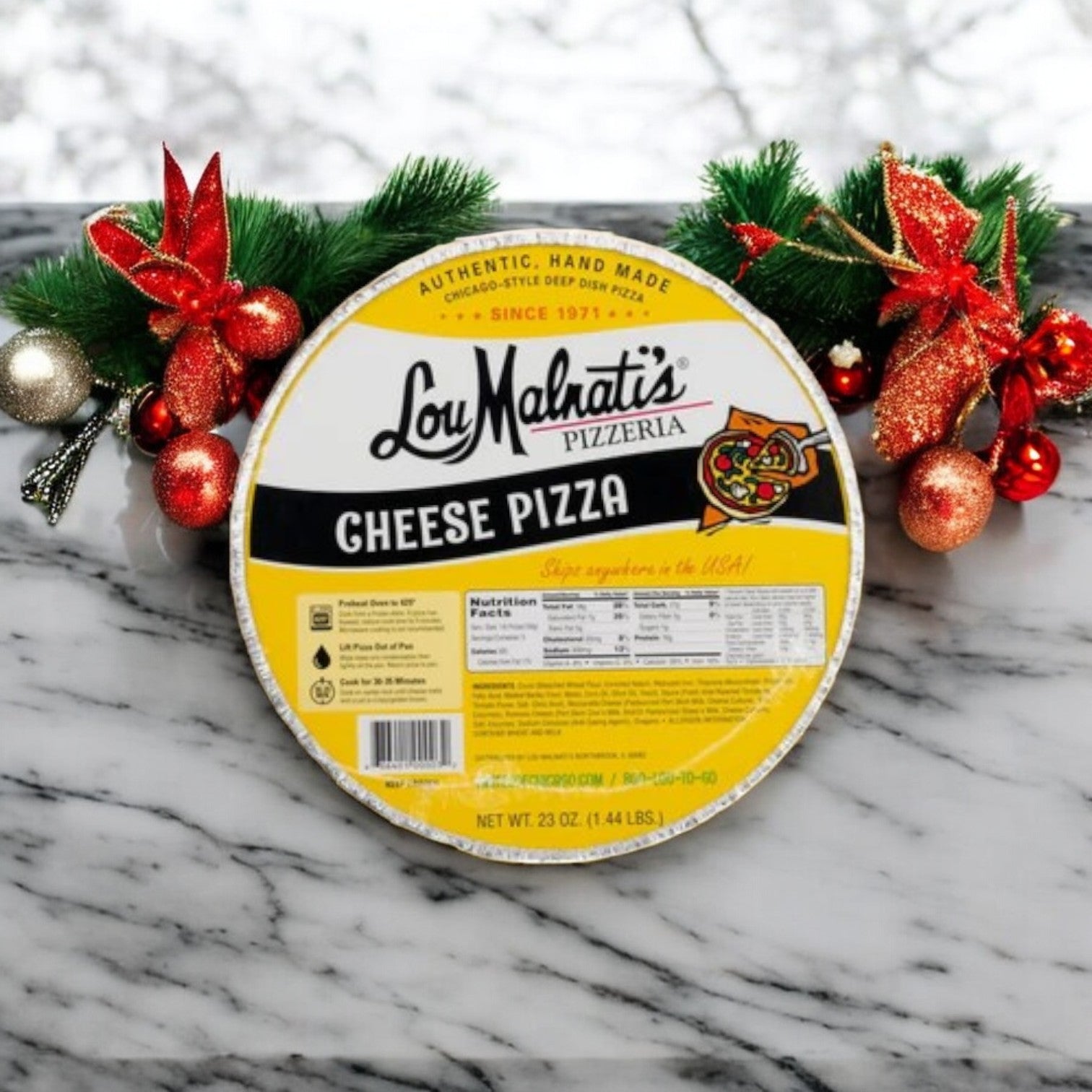 A Lou Malnati's Deep Dish & Mrs. Fields 3 Pack Combo! on a marble surface, adorned with red and gold ornaments and lush greenery, beautifully embodies the Chicago deep-dish pizza tradition courtesy of Easy Lunches.