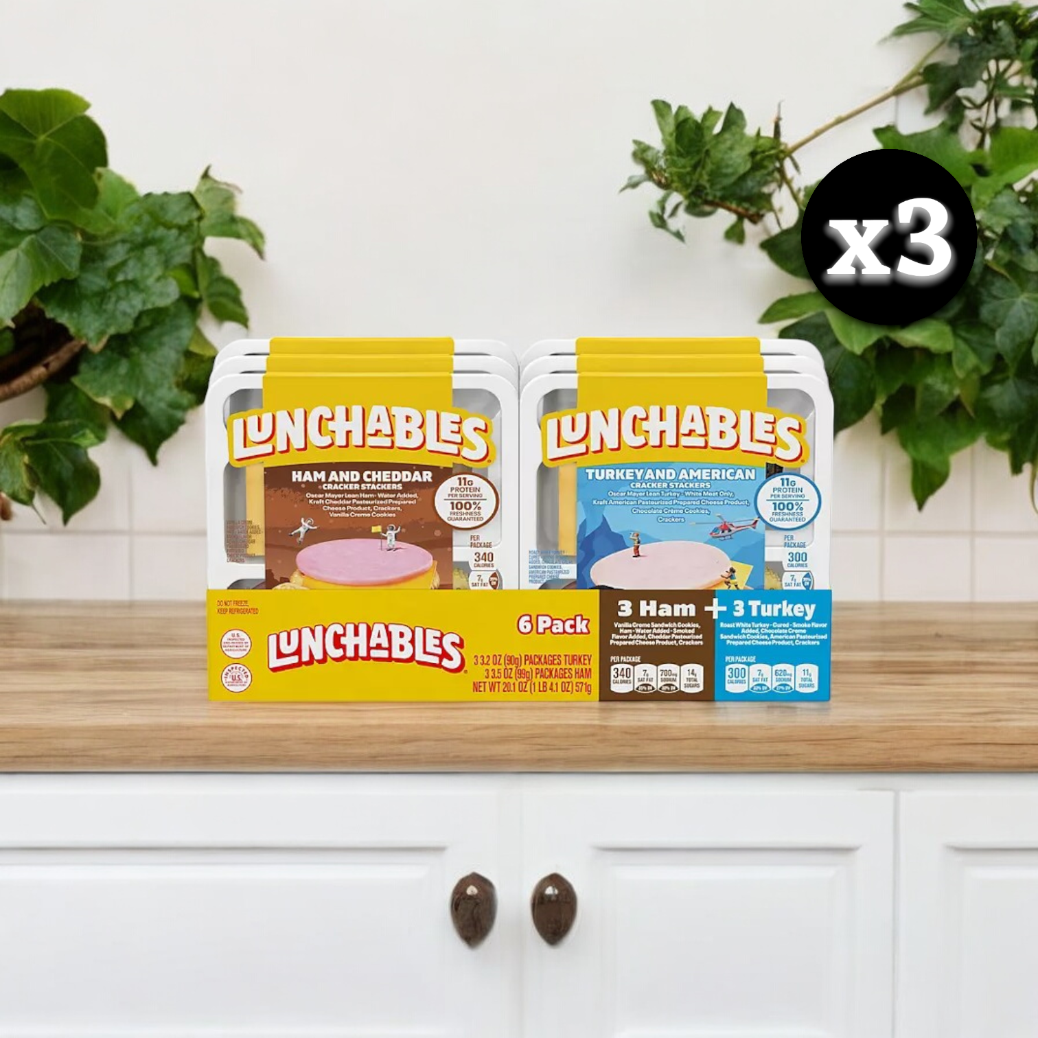 A plain cardboard box prominently displays an image of the Lunchables Cracker Stackers Snack Kit Variety Pack, which includes three packages containing a total of 18 Lunchables. The pack features 6-count packs in both turkey & American and ham & cheddar varieties, allowing you to create your own stacks and enjoy a variety of flavors from the trusted Lunchables brand.