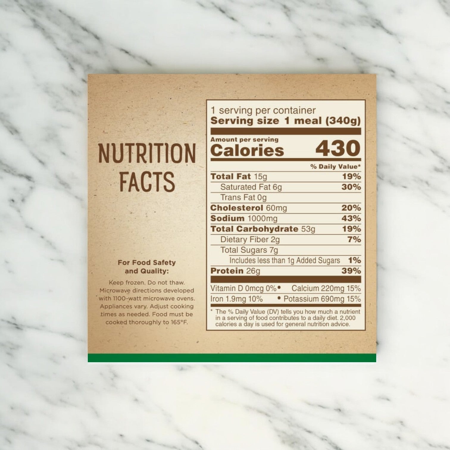 Image shows a nutrition facts label on a beige background. It lists calories, total fat, cholesterol, sodium, total carbohydrate, protein, vitamins, and minerals for one serving of Marie Callender's comforting meal—a Cheesy Chicken and Rice Bowl.