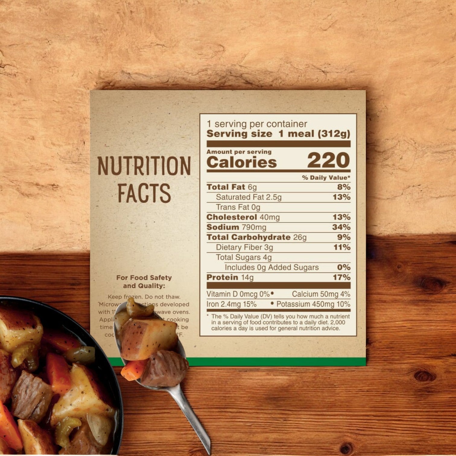 The nutrition facts label for a Marie Callender's Slow Roasted Beef Pot Roast Bowl, 11 oz. - 1 Count reveals 220 calories per serving. The image shows detailed nutritional information on a beige card, with a bowl of the home-cooked style meal partially visible in the corner.