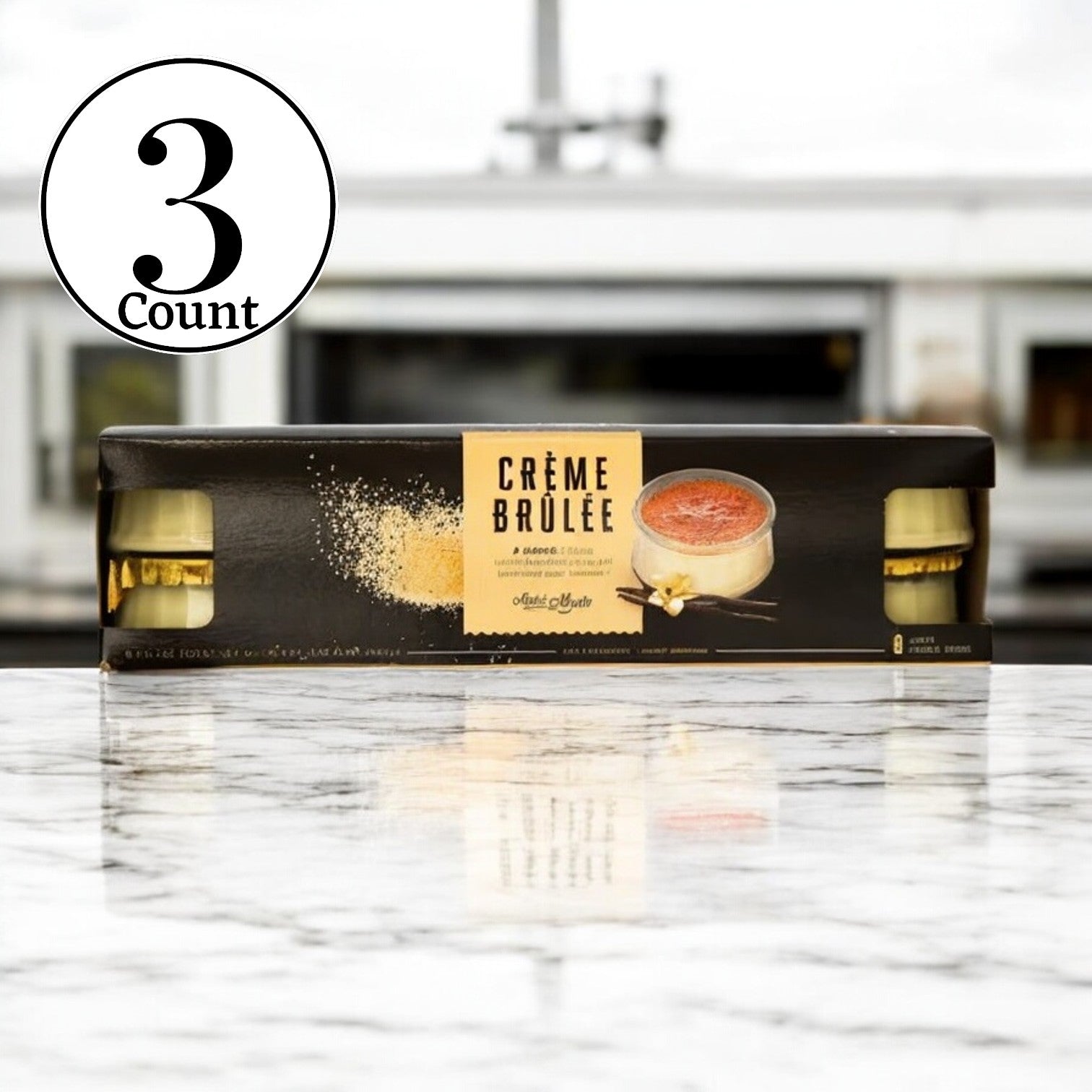 Three packages of Marie Morin Creme Brûlée, each containing 3.7oz jars for a total of 24 delectable desserts, are elegantly arranged on a marble surface. The premium label features both text and an enticing image of this classic French treat.