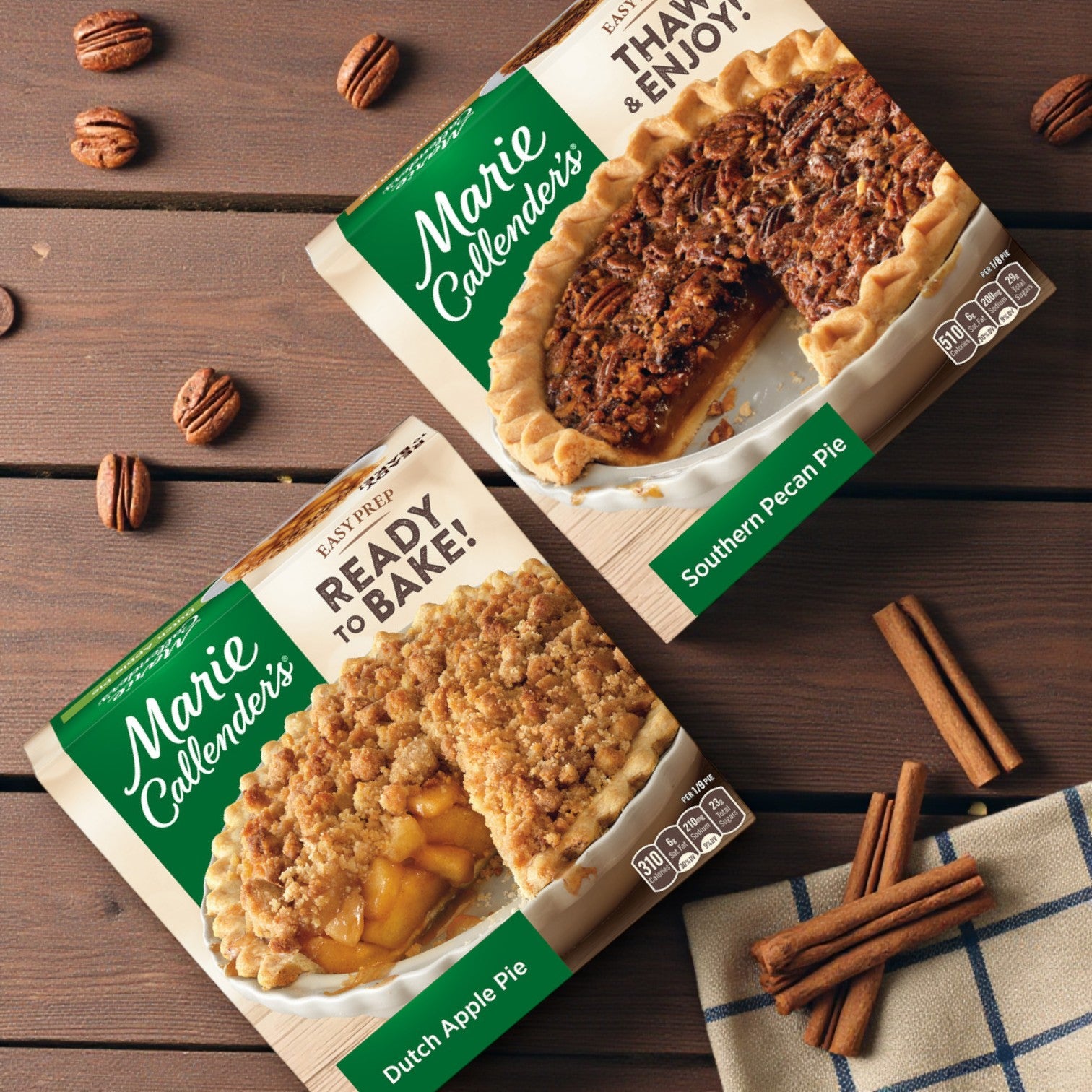 Marie Callender’s Combo: Southern Pecan Pie & Dutch Apple Pie—frozen desserts—are shown boxed on a wooden table with pecans, cinnamon sticks, and a checkered cloth.