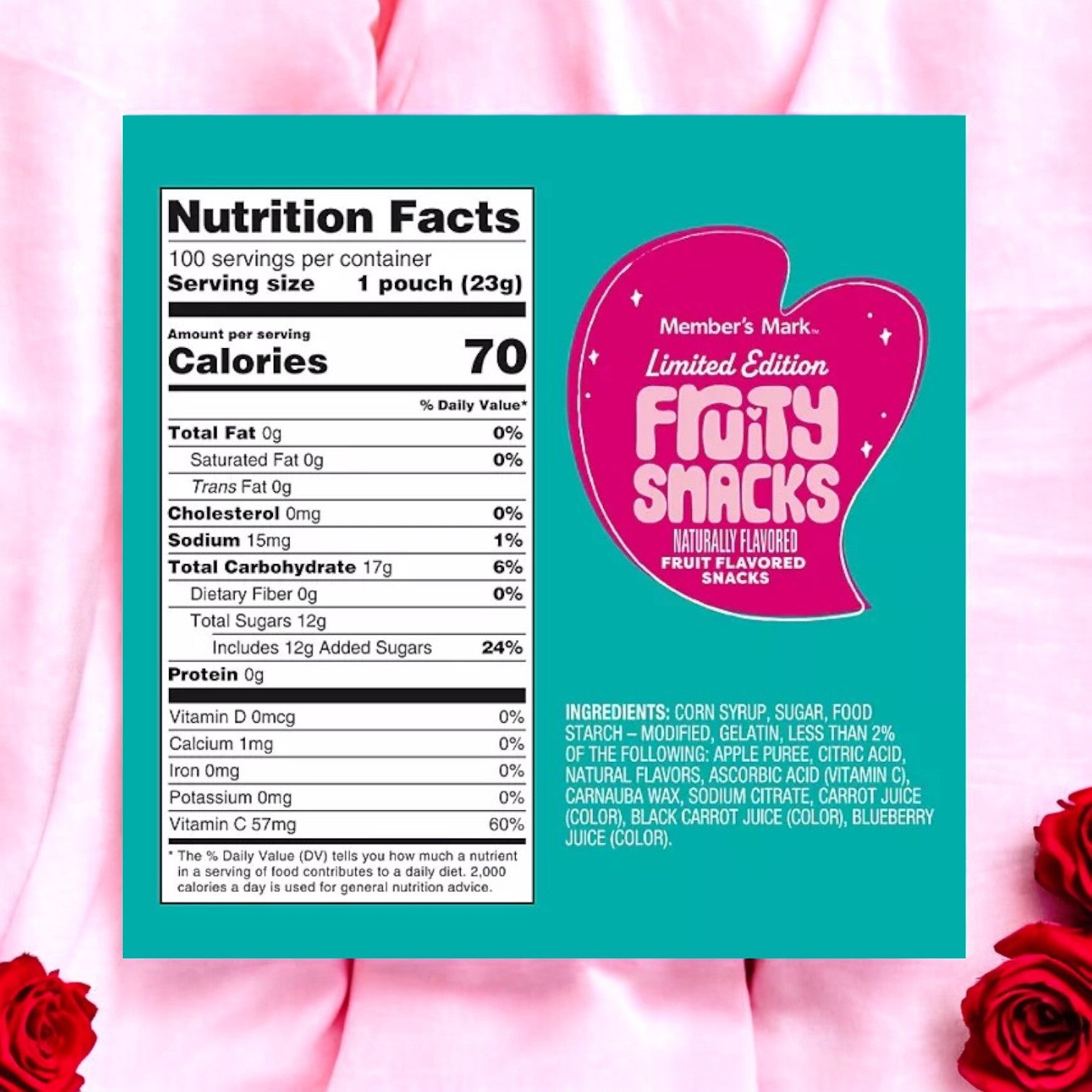 The nutrition label for Member's Mark Valentine's Day Fruity Snacks (0.8 oz., 100 pk) is set on a turquoise background with a heart shape, detailing calories, fats, sodium, and sugars. Ingredients are below. It has a pink backdrop with red roses—ideal individually wrapped treats for your loved ones!.