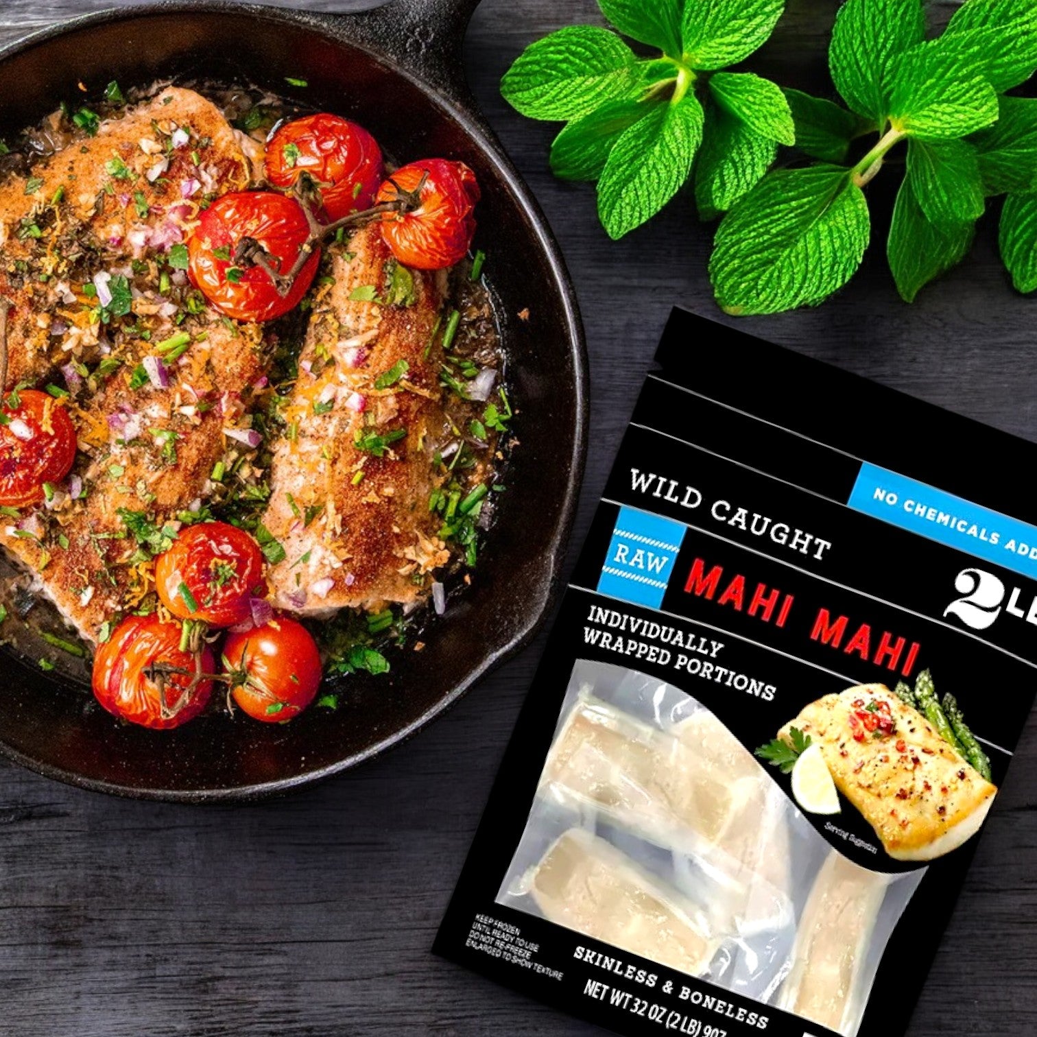 In a skillet, fish with herbs and tomatoes sizzles beside a package of Member's Mark Wild Caught Mahi Mahi Portions. Mint adds freshness to the sustainably sourced, lean, skinless, boneless protein that's ready to prepare.