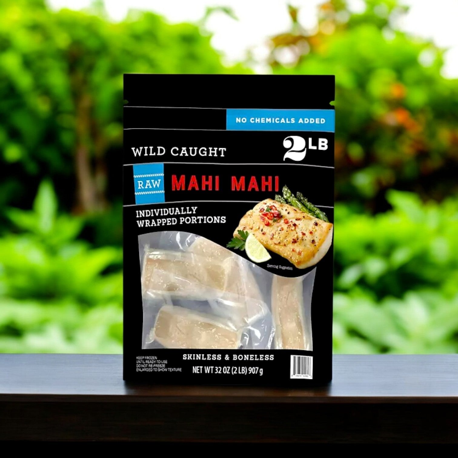 Member's Mark Wild Caught Mahi Mahi Portions, 2 lbs. of skinless and boneless fillets, are labeled "no chemicals added" and feature an image of cooked fish with a blurred outdoor background—ideal for those looking for premium frozen seafood.