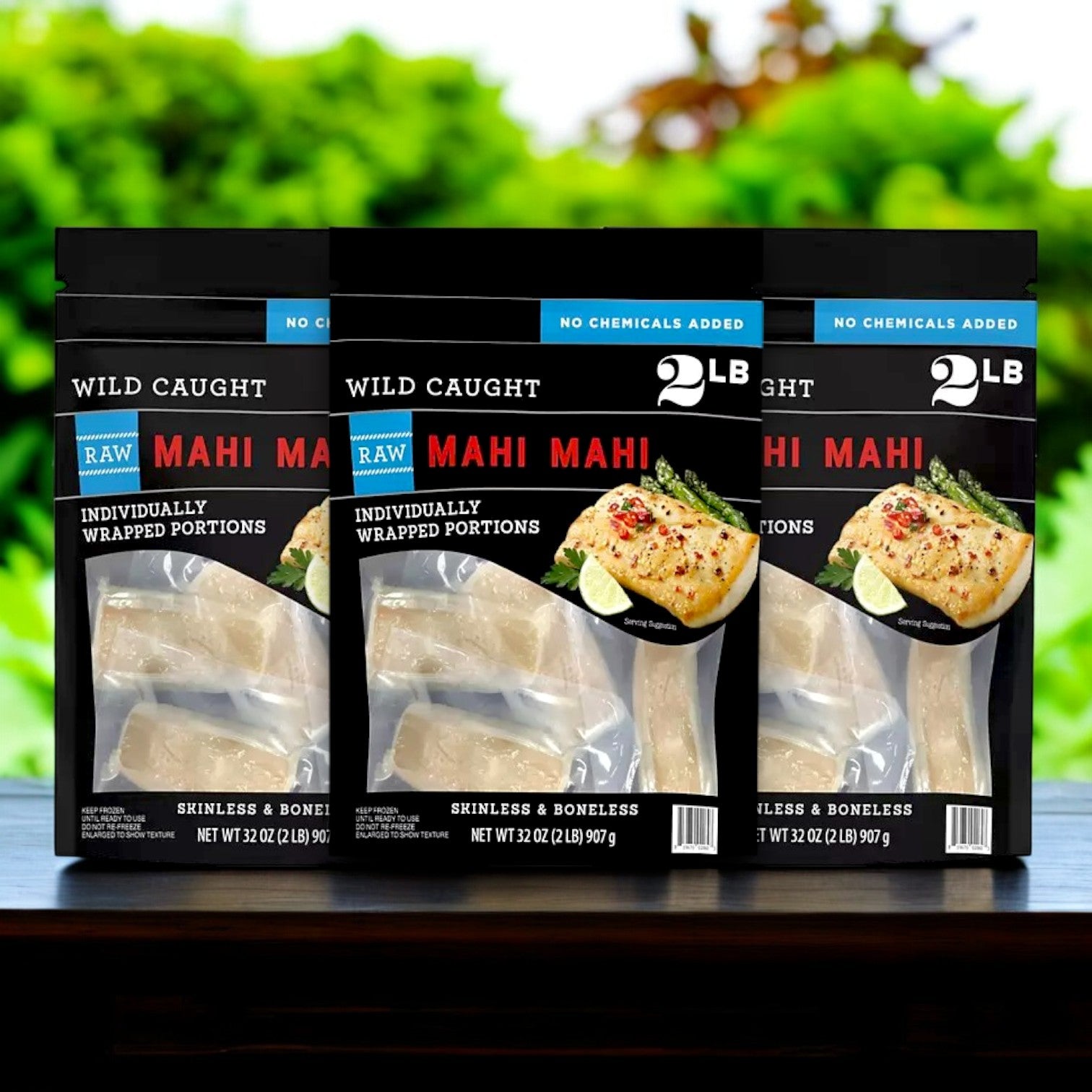 Three packages of Member's Mark Wild Caught Mahi Mahi Portions, totaling 6 lbs., are sustainably sourced and come frozen, skinless, boneless, and individually wrapped. The package features an image of cooked fish with lime, ideal for anyone looking for a lean protein option.