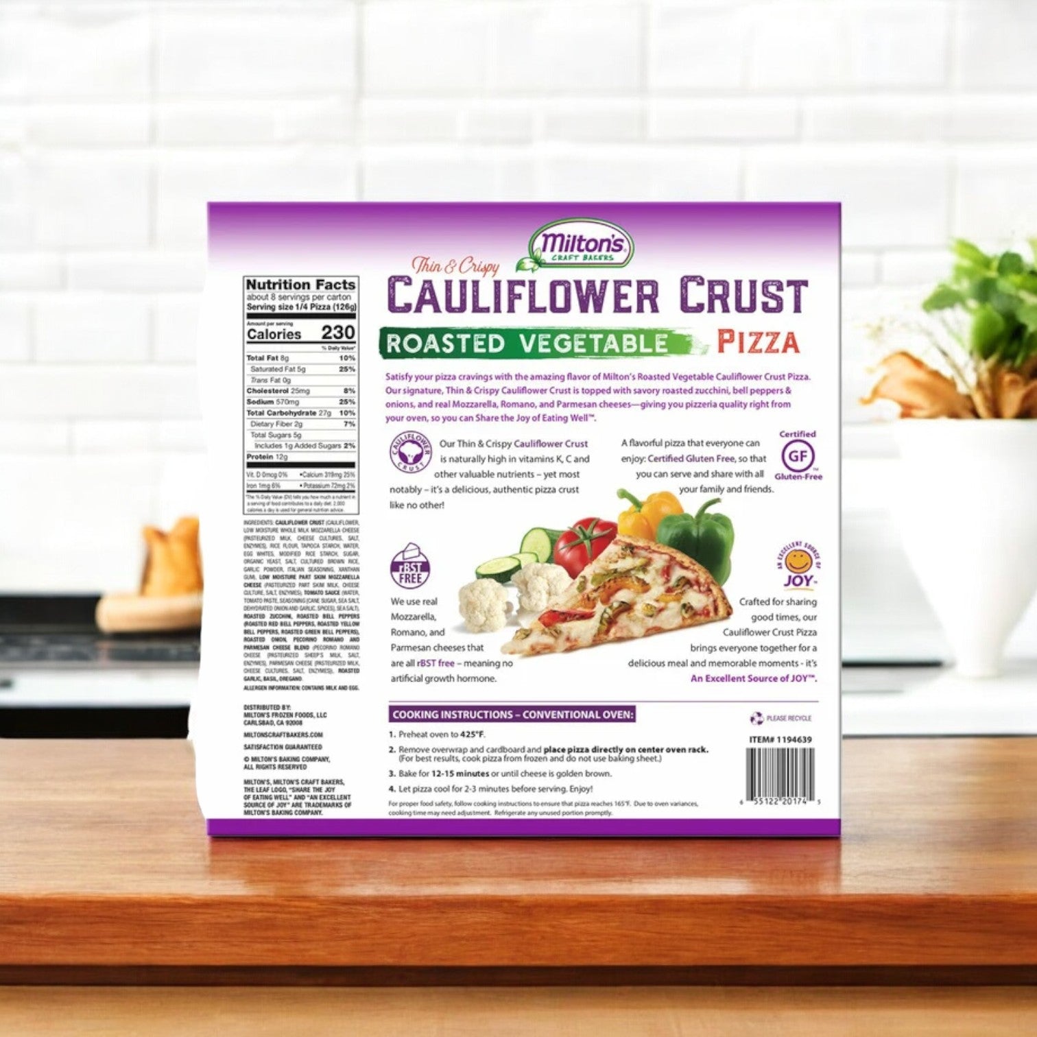 A package of Milton's Cauliflower Crust Pizza, Roasted Vegetable, 35.6 oz, 2-count sits on a kitchen counter, highlighting its nutritional facts and wholesome ingredients.