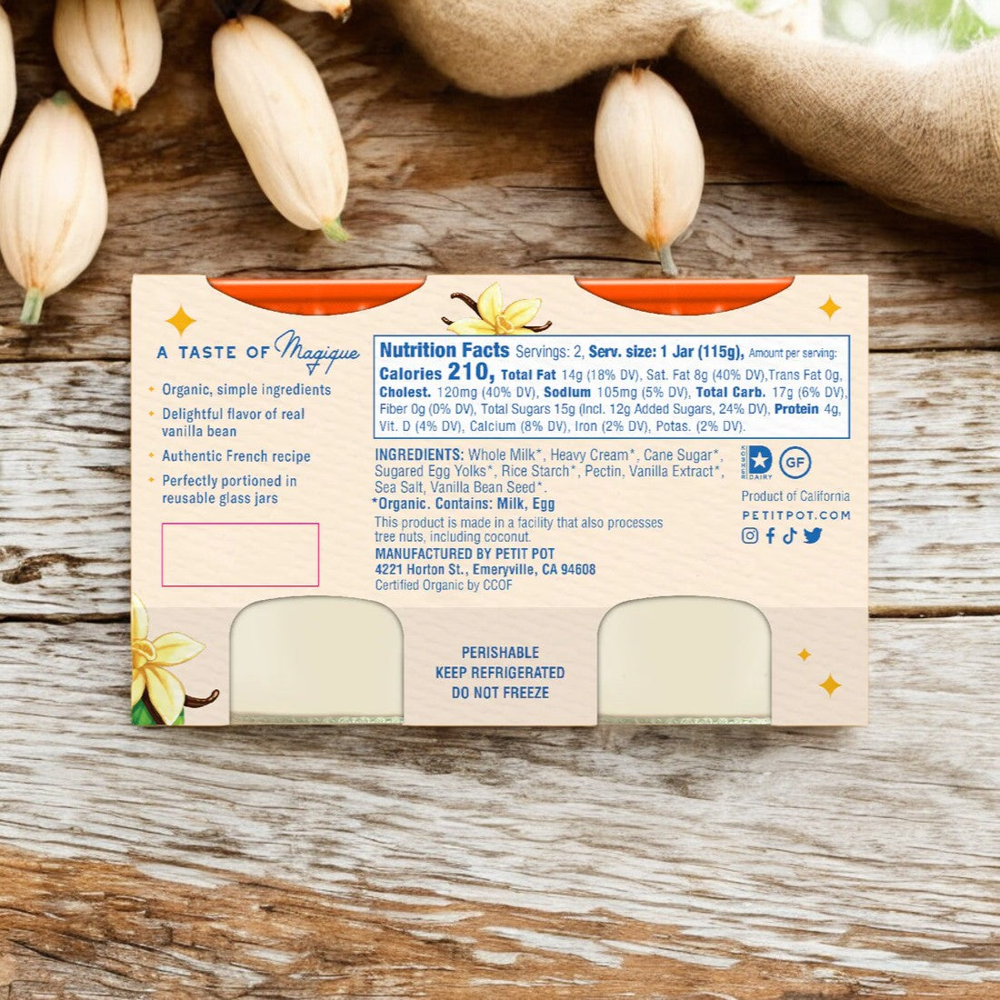 A jar of Organic French Vanilla Pudding from Petit Pot, showcasing its back label with nutritional facts, ingredients, and manufacturer's details, is placed on a wooden surface. The label emphasizes the use of organic ingredients and the delightful French Vanilla flavor.