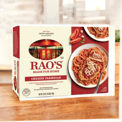 A box of Easy Lunches Rao's Chicken Parmesan 26 oz frozen entree, featuring an image of breaded chicken over spaghetti with marinara sauce. The packaging highlights "Made for Home" and "No Preservatives" branding.